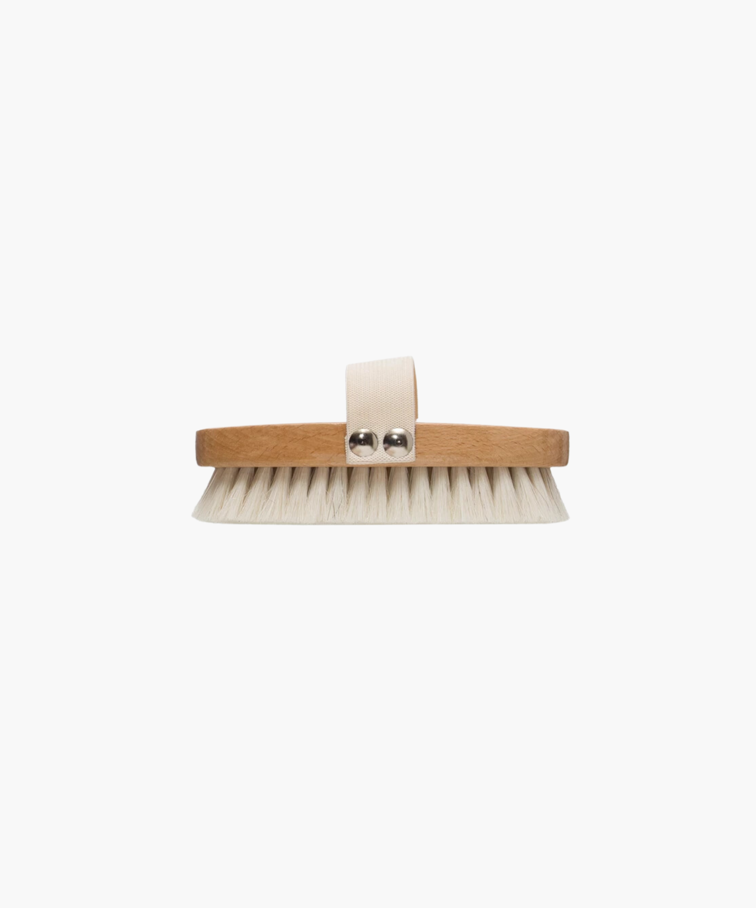 Wooden dry brush with white bristles and a beige fabric strap on top, against a white background. The brush conveys a minimalist, clean aesthetic.