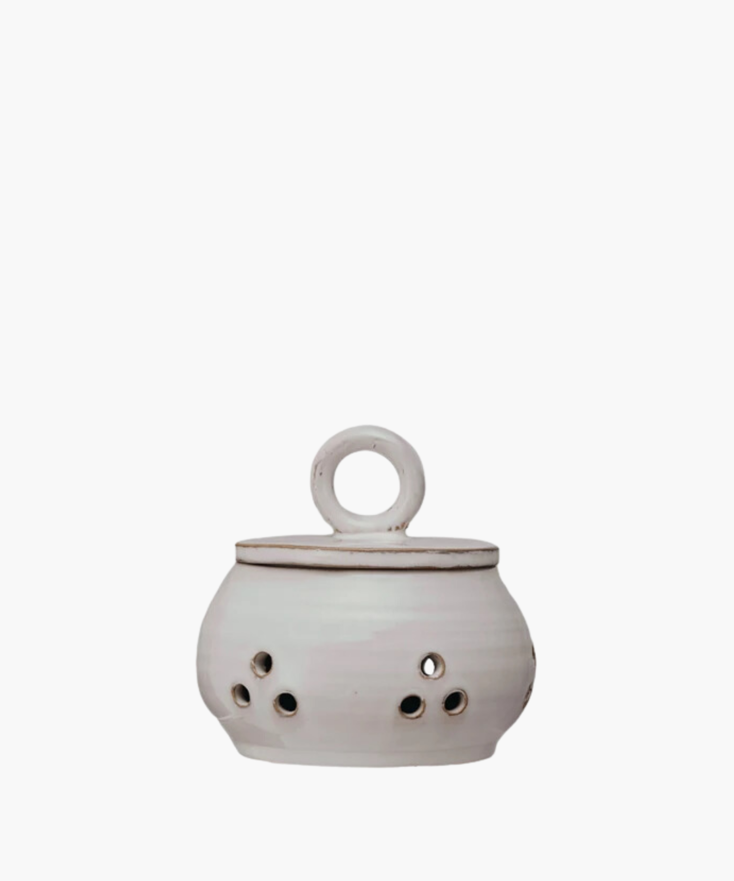 Ceramic garlic or onion keeper with a lid and circular handle, featuring small circular cutouts on the body. The pot has a rustic, handcrafted appearance.