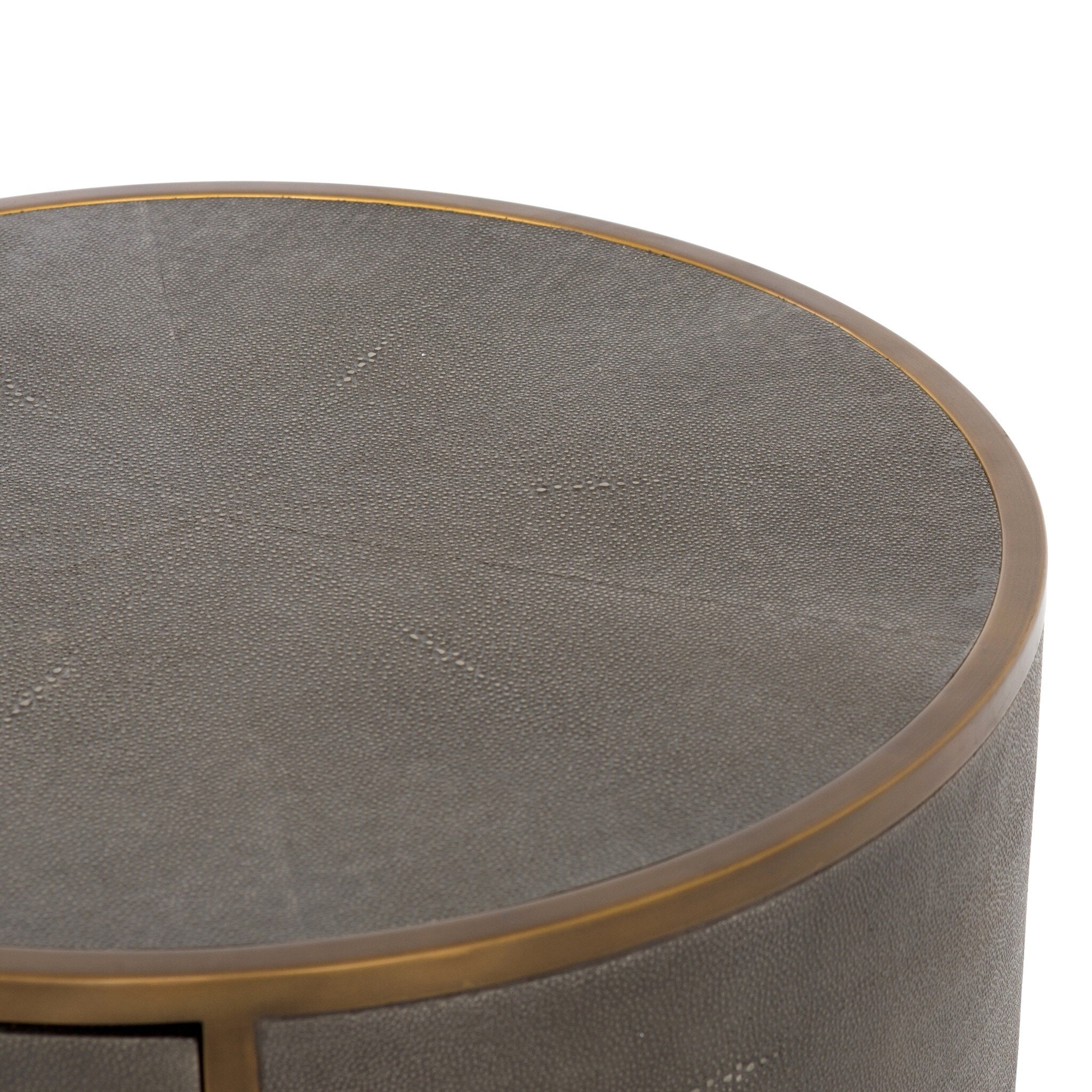 Round nightstand with a drawer and bronze legs on a white background.