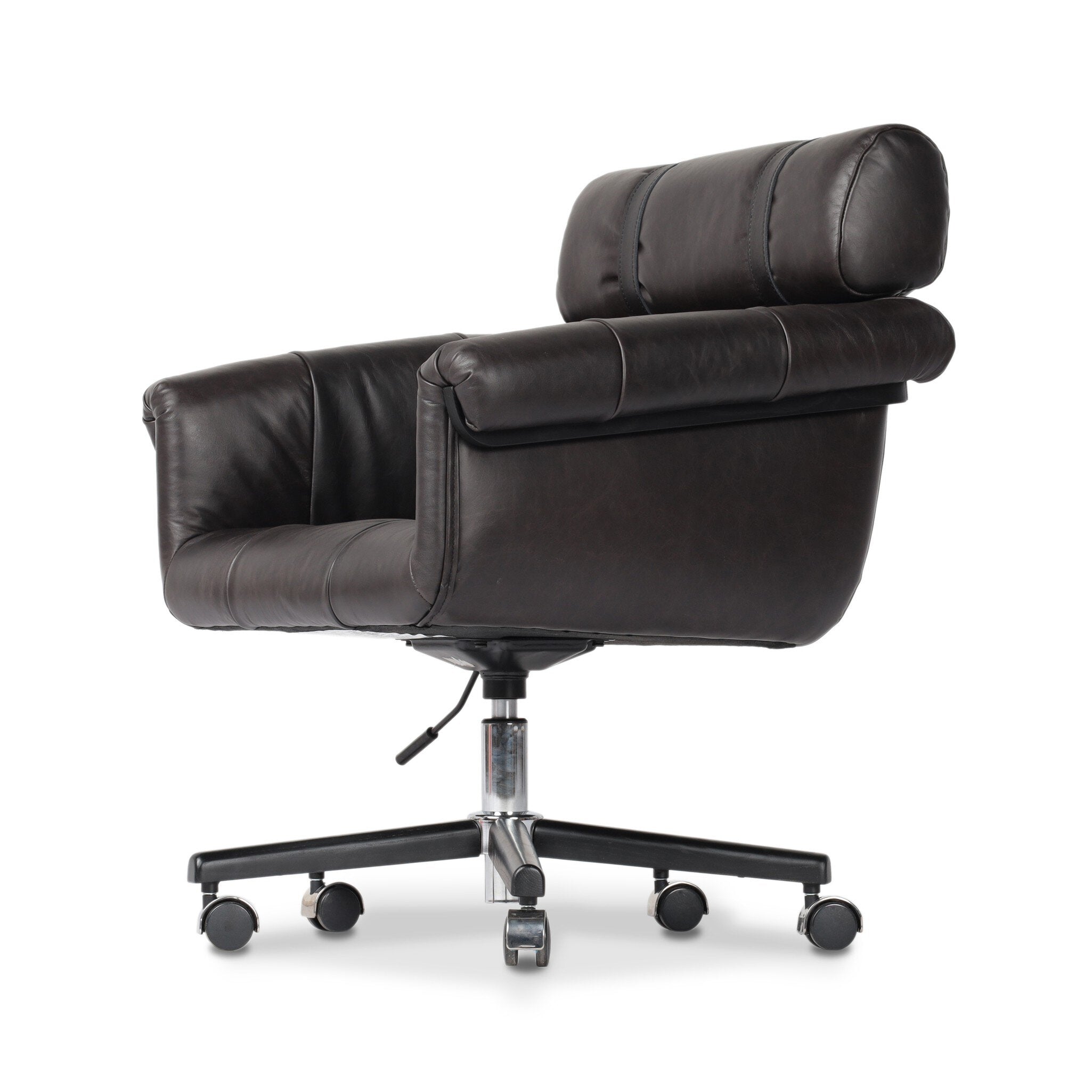 Tufted black leather desk chair with a chrome and black base on a white background. 