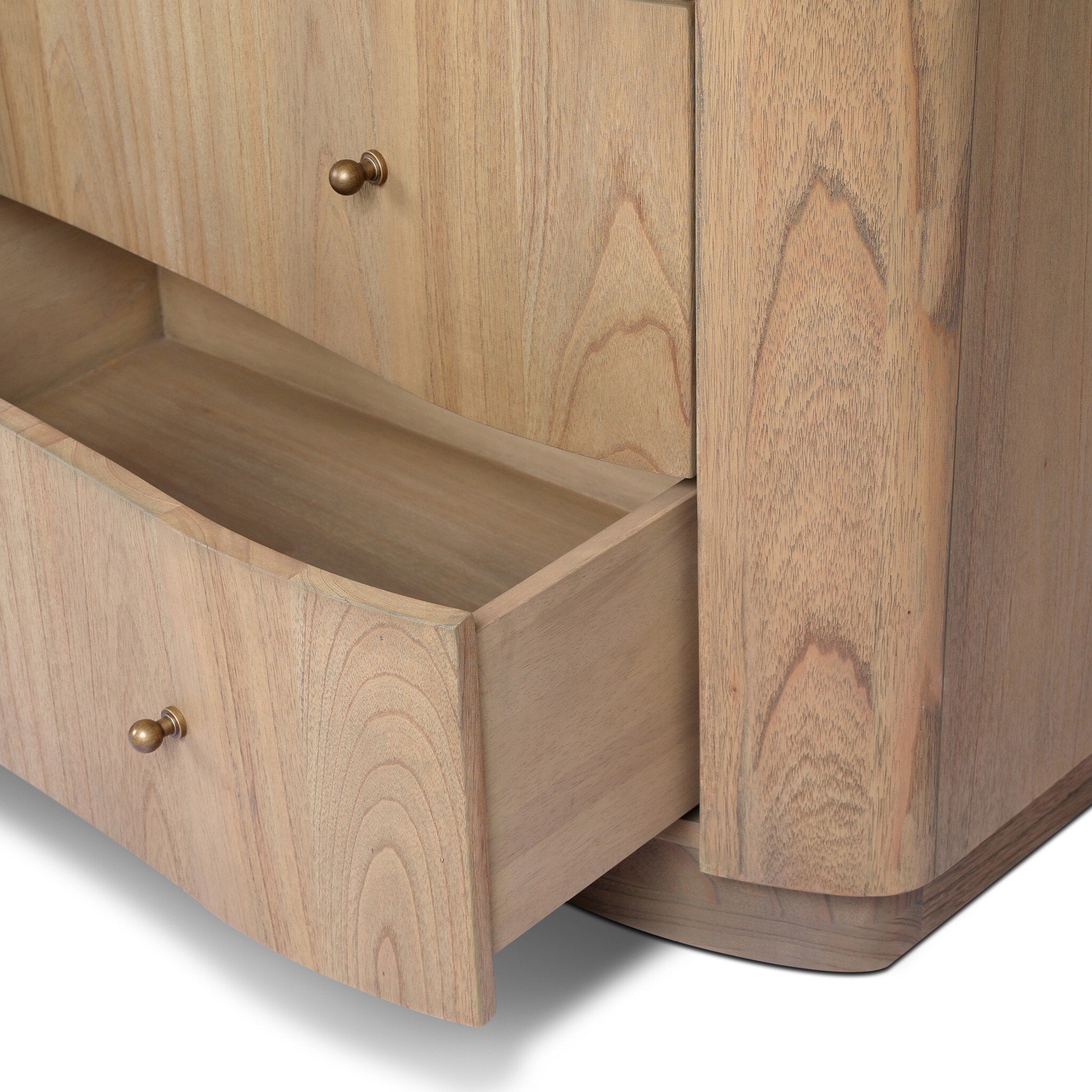 Wooden cabinet with two drawers and brass handles on a white background.