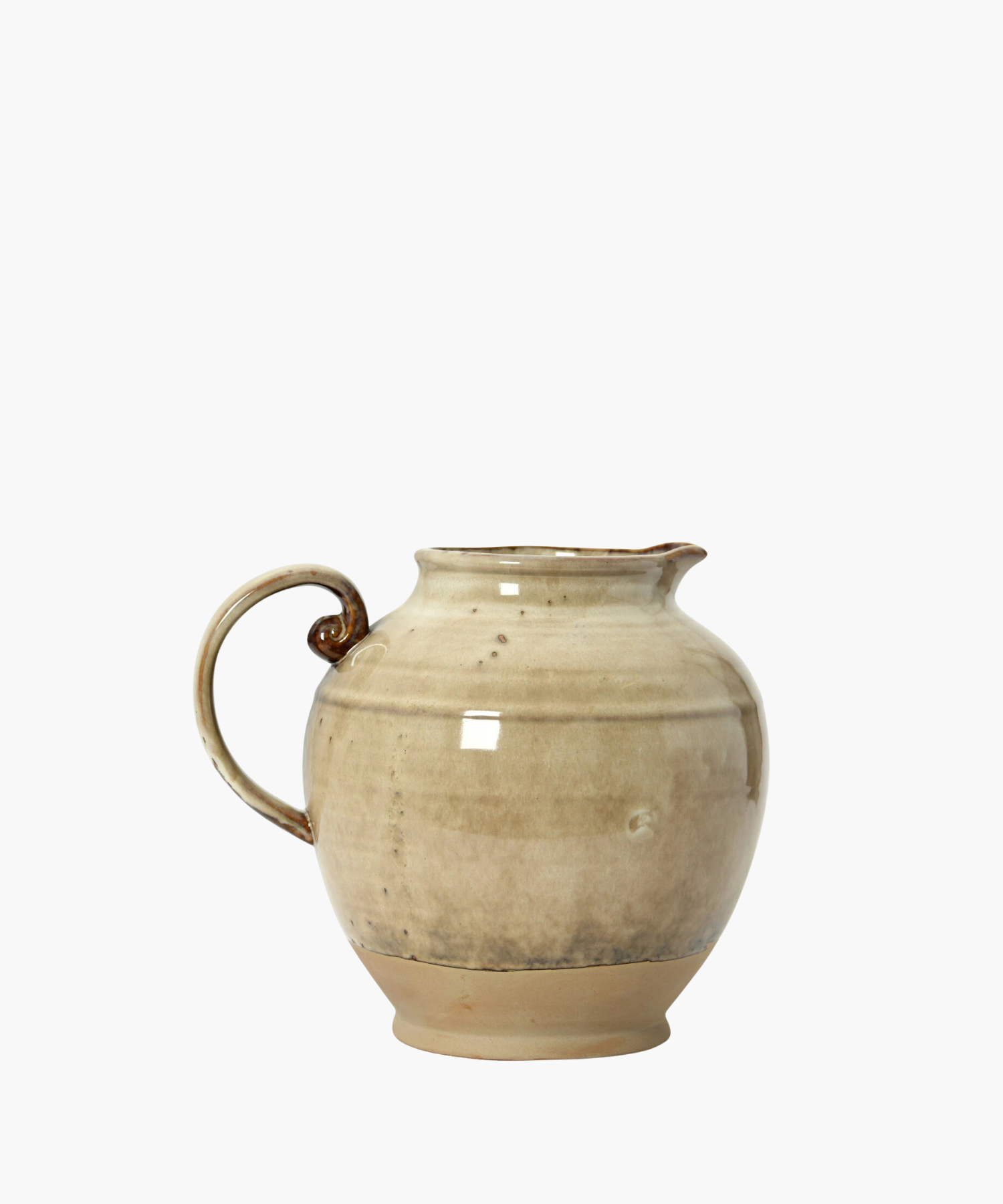 A beige ceramic pitcher with a rounded body, a curved handle, and a narrow spout. The glaze has subtle darker speckles, giving it a rustic feel.