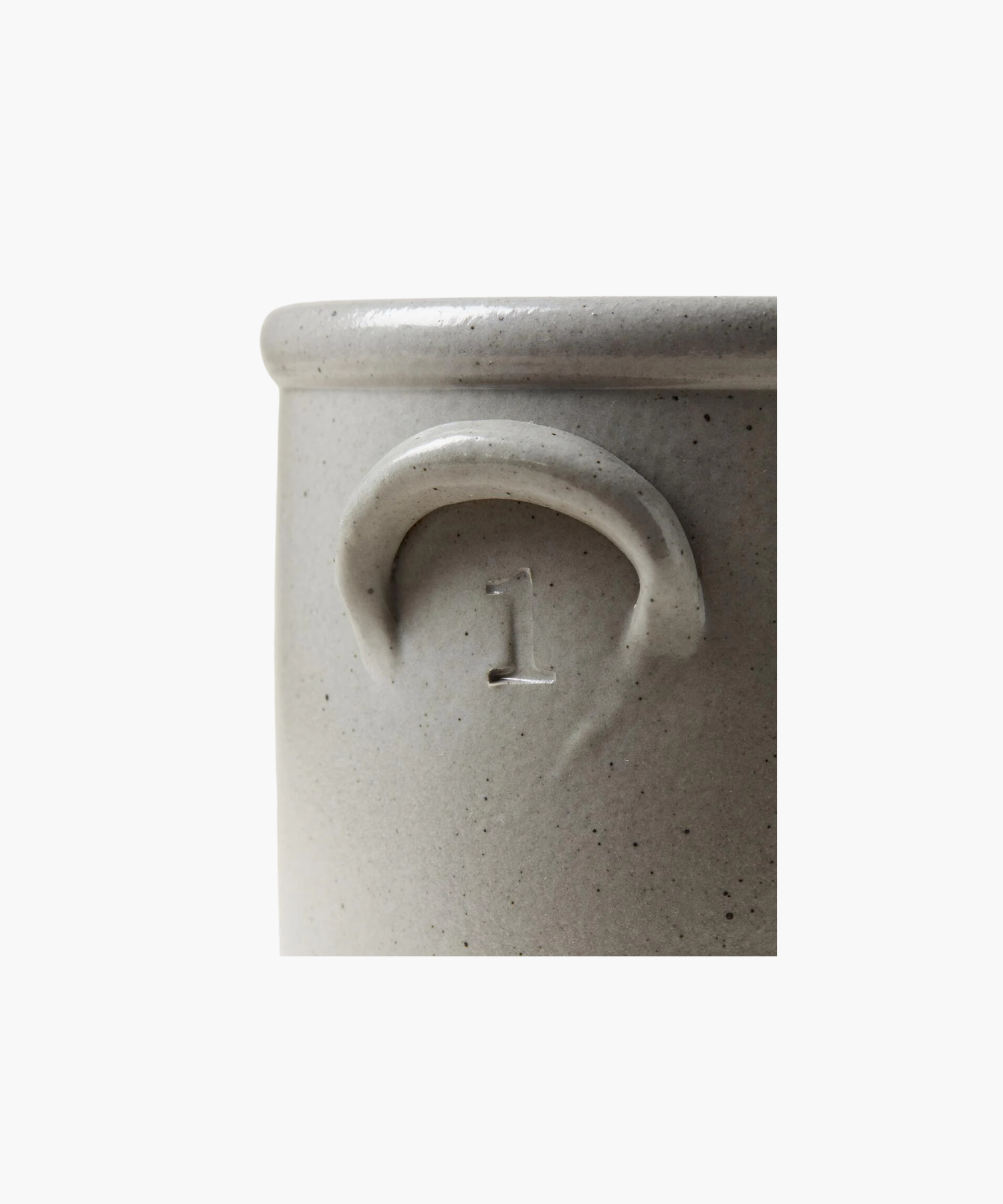 A detailed picture of a gray stoneware crock highlighting the color, texture, and size.  This crock has a subtle embossed "1" under the handle, conveying a rustic, artisanal feel.