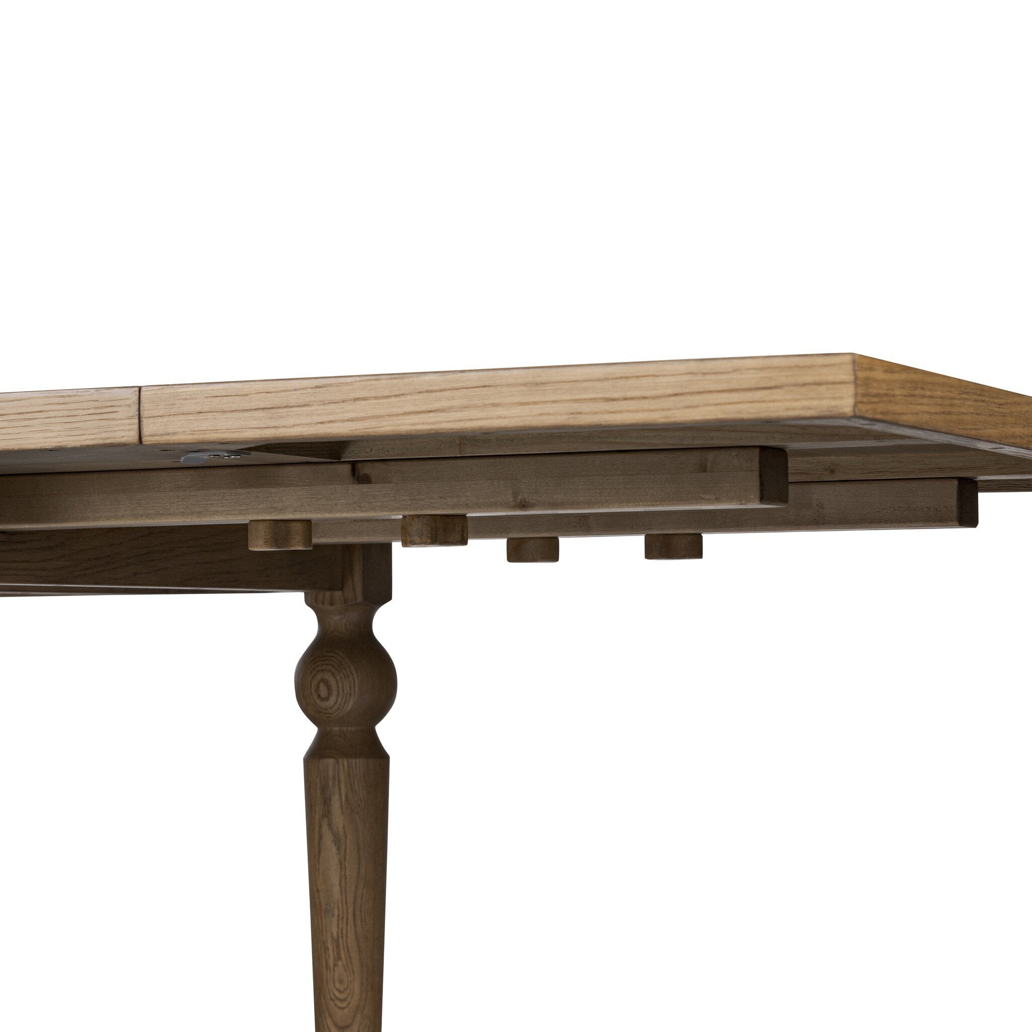 Close up of a rectangular wood dining table on a white background.