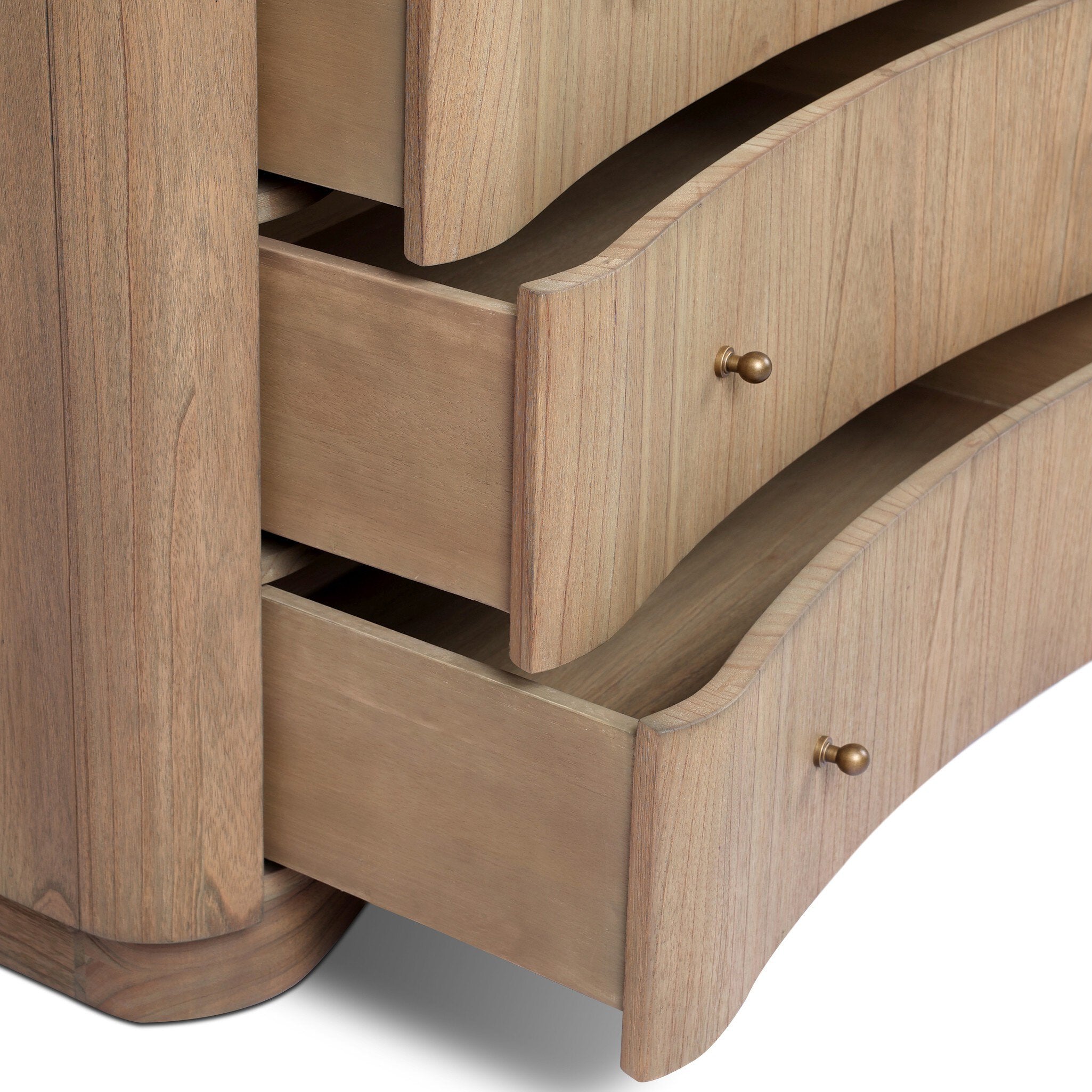 Close up of a wooden dresser with multiple drawers and a cream-white marble top on a white background.