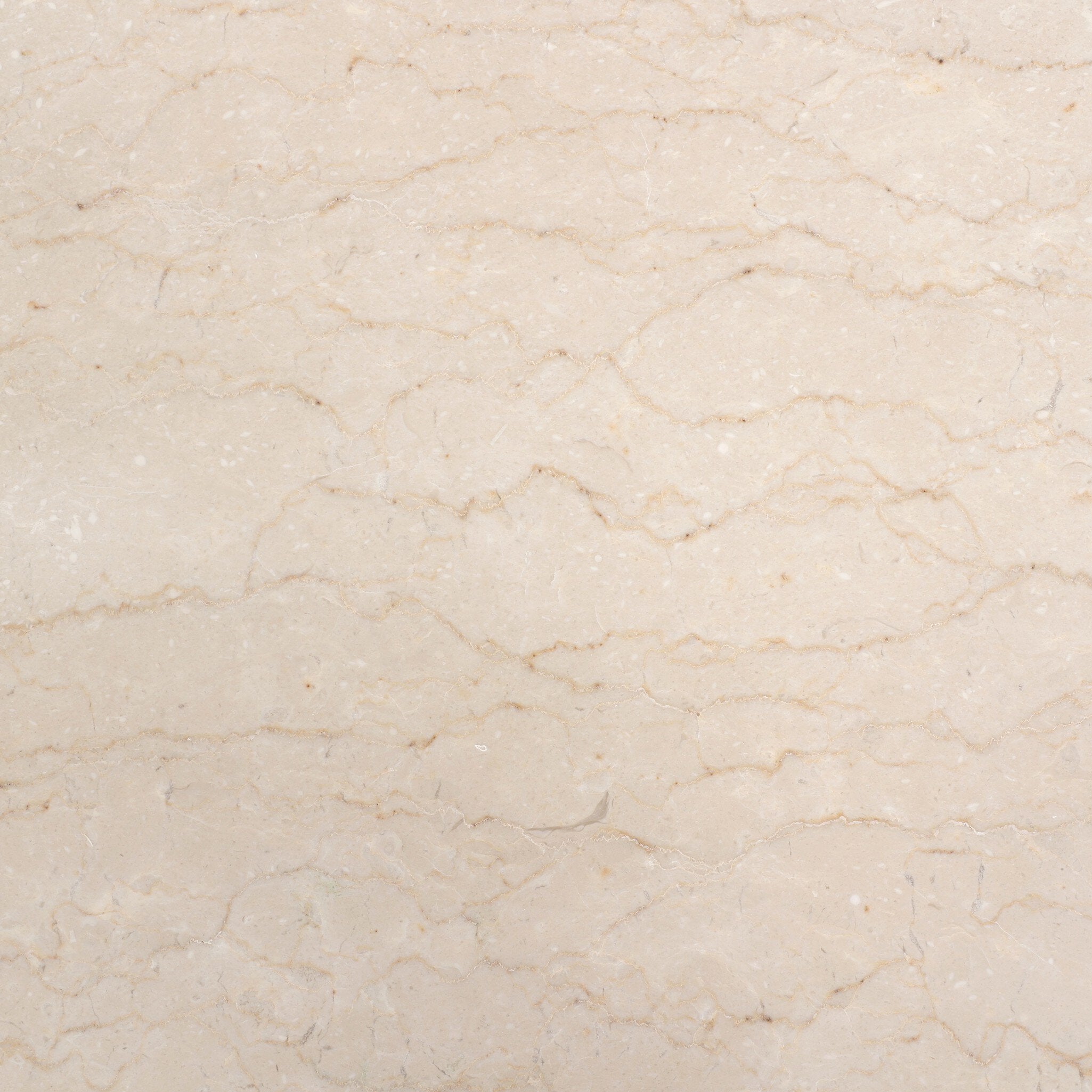 Close up of the cream-white marble top showing its color and veining. 