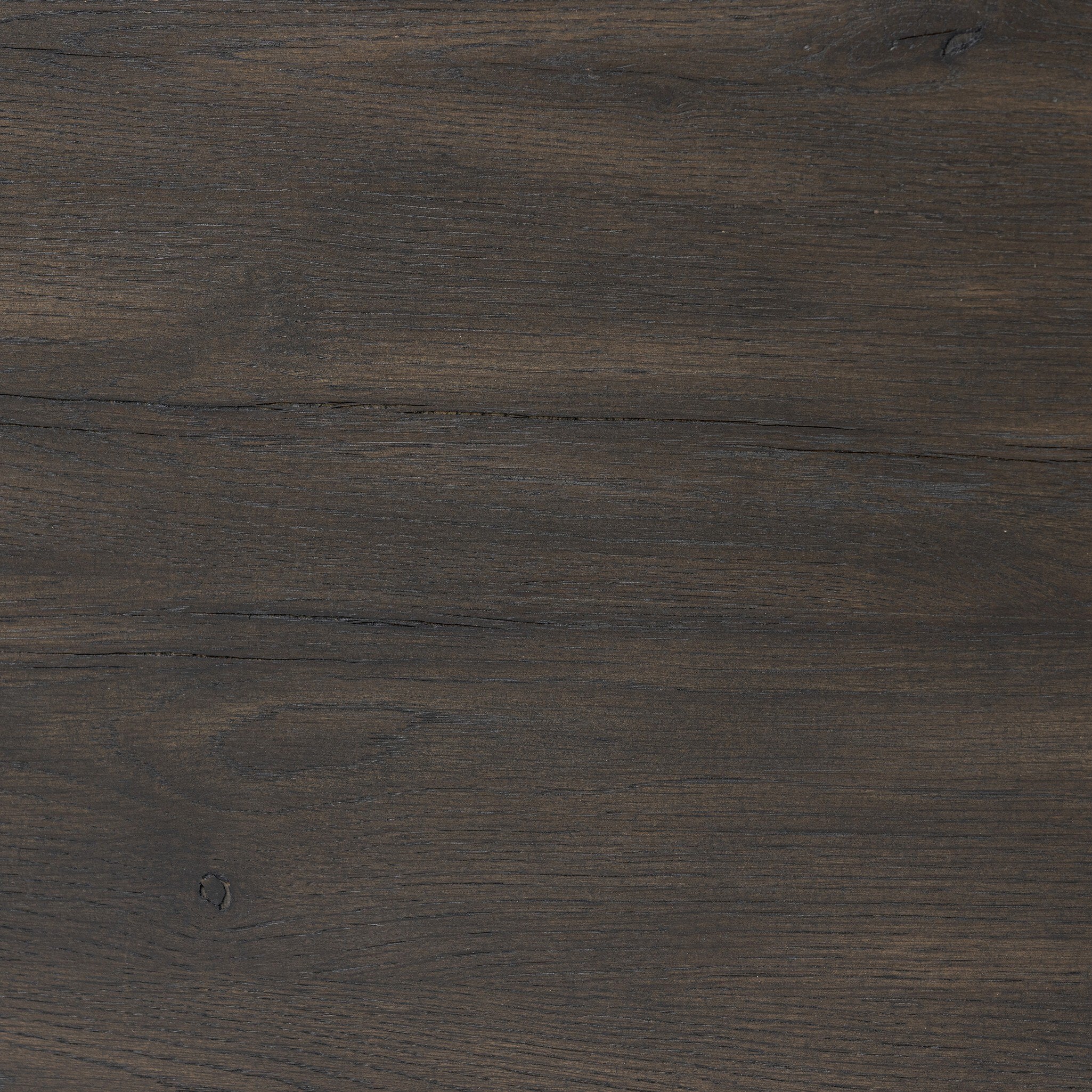 Close up of the nightstand showing its black finish and oak wood grain. 