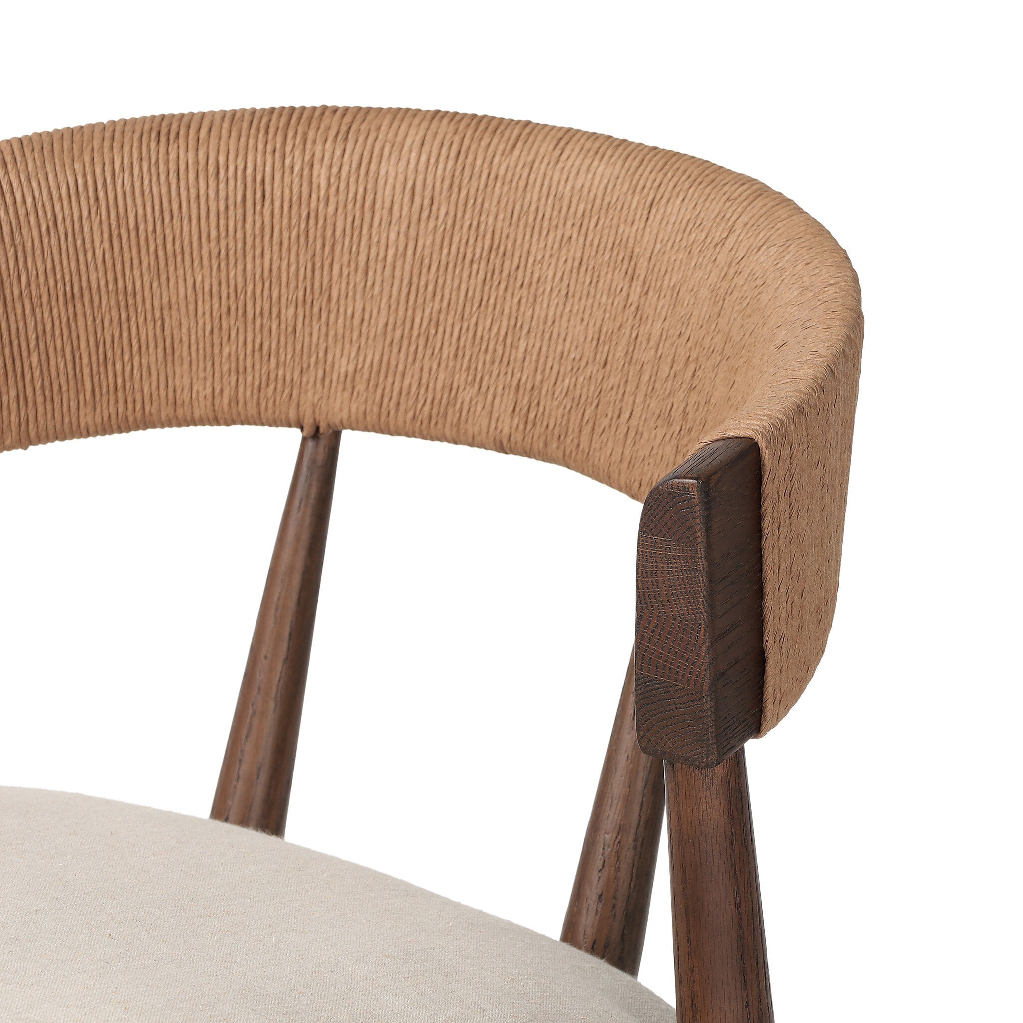 Solid oak dining chair with tapered legs, a woven backrest, and natural color seat cushion on a white background.