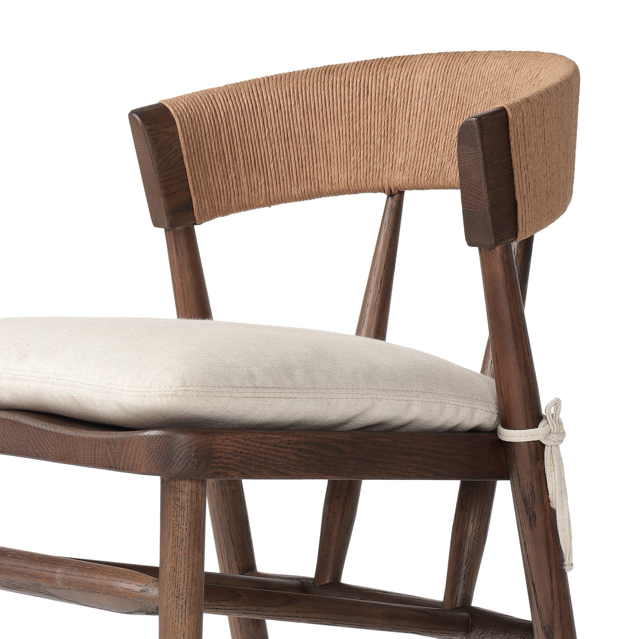 Solid oak dining chair with tapered legs, a woven backrest, and natural color seat cushion on a white background.