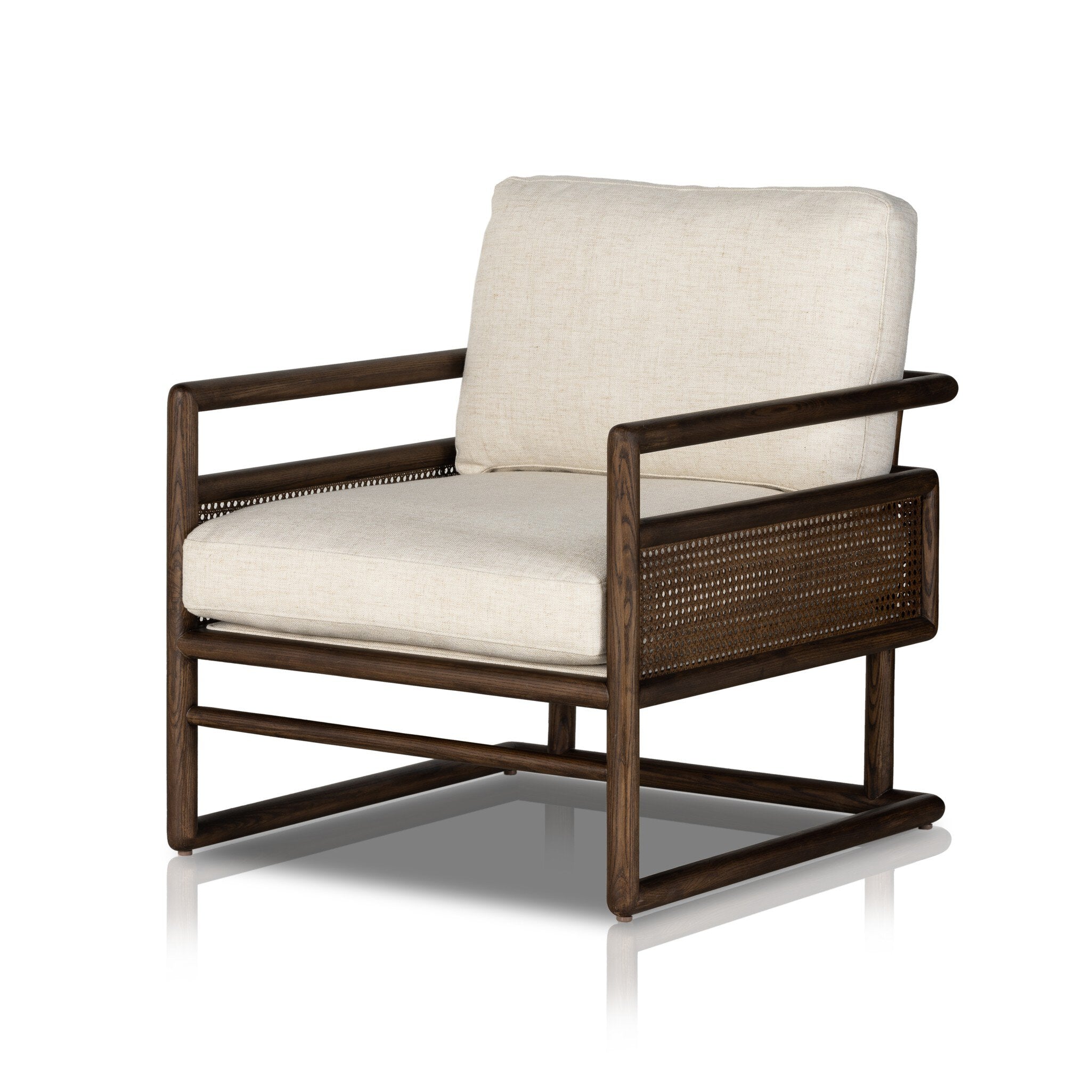Chair with neutral linen fabric, cane panels with open rounded framing.