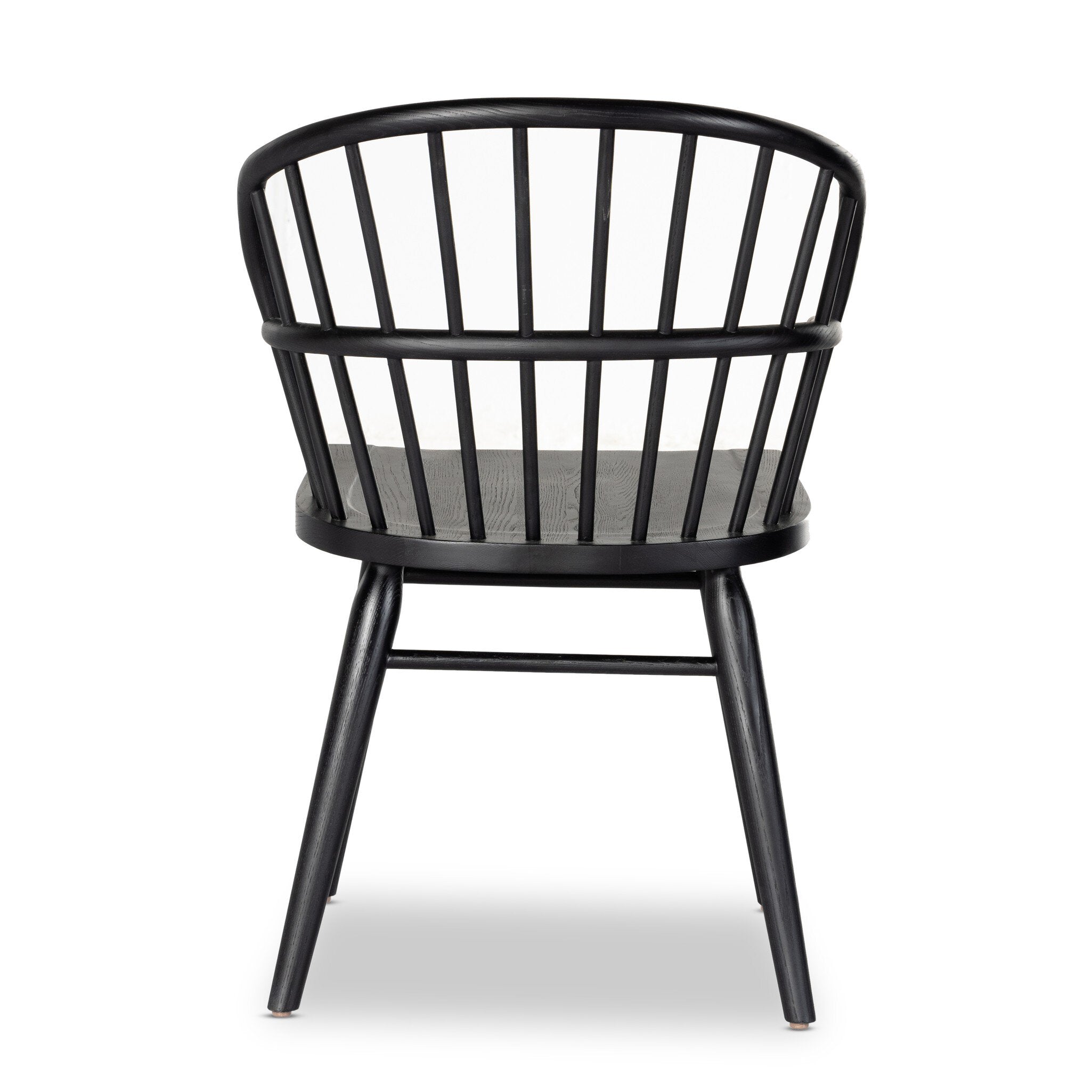 The back of a black dining chair with a minimalist design on a white background.