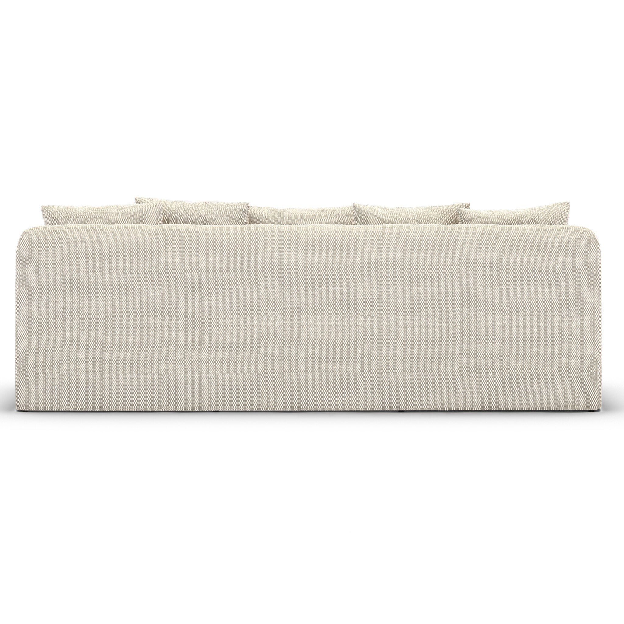  The back of the sand colored slipcover outdoor sofa on a white background.