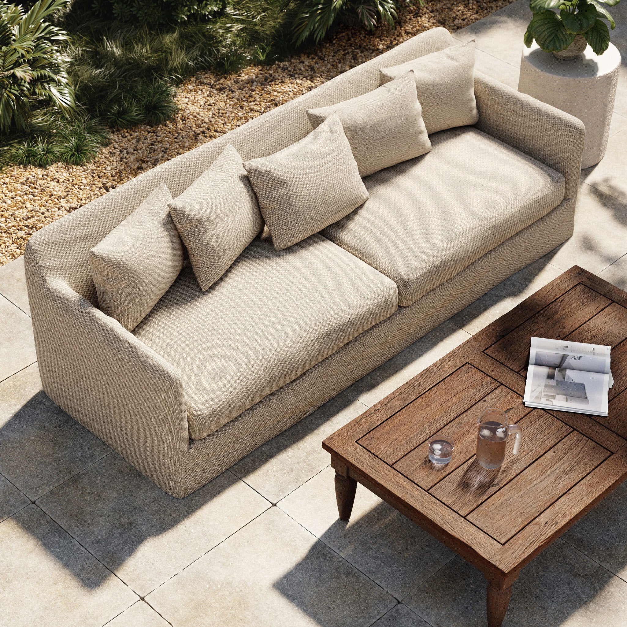 Outdoor sofa and coffee style styled on a patio. 