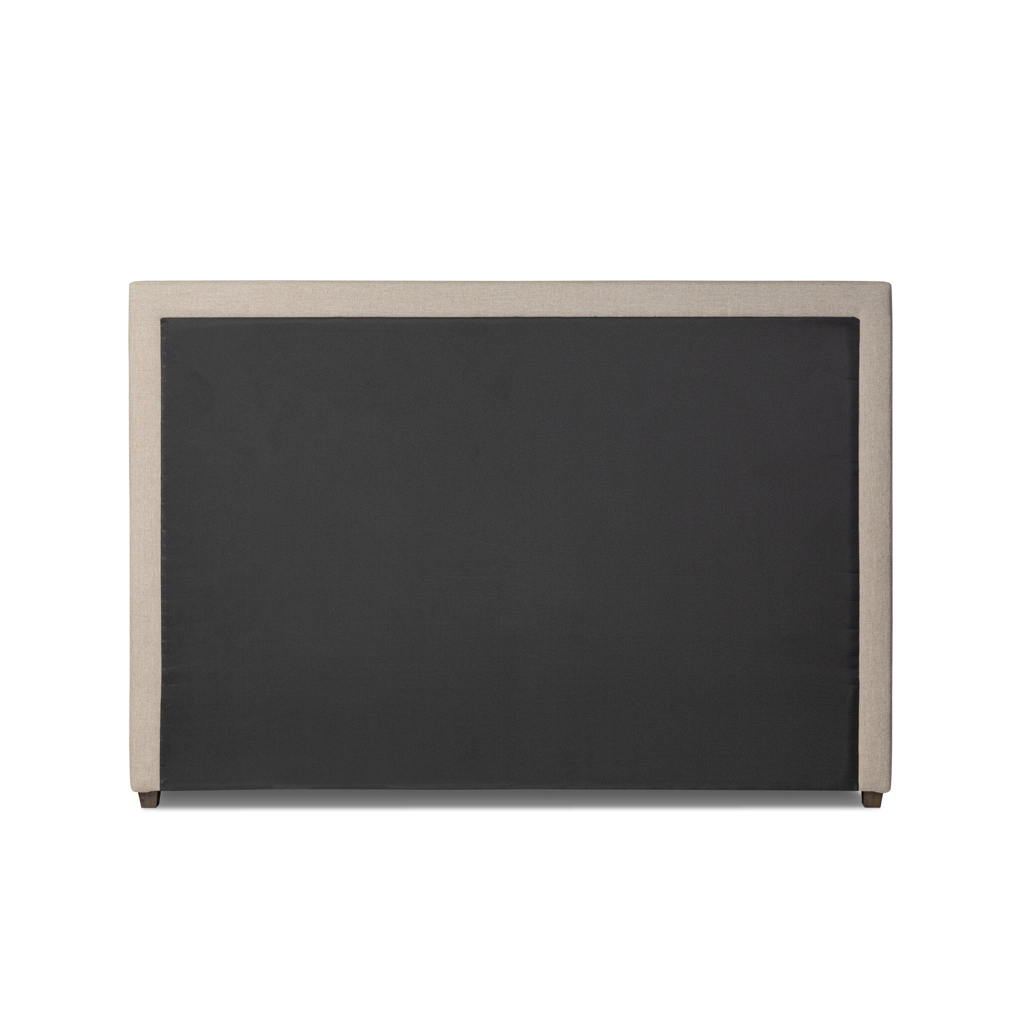 The back of a taupe upholstered bed with horizontal channeling on the headboard and white bedding on a white background.