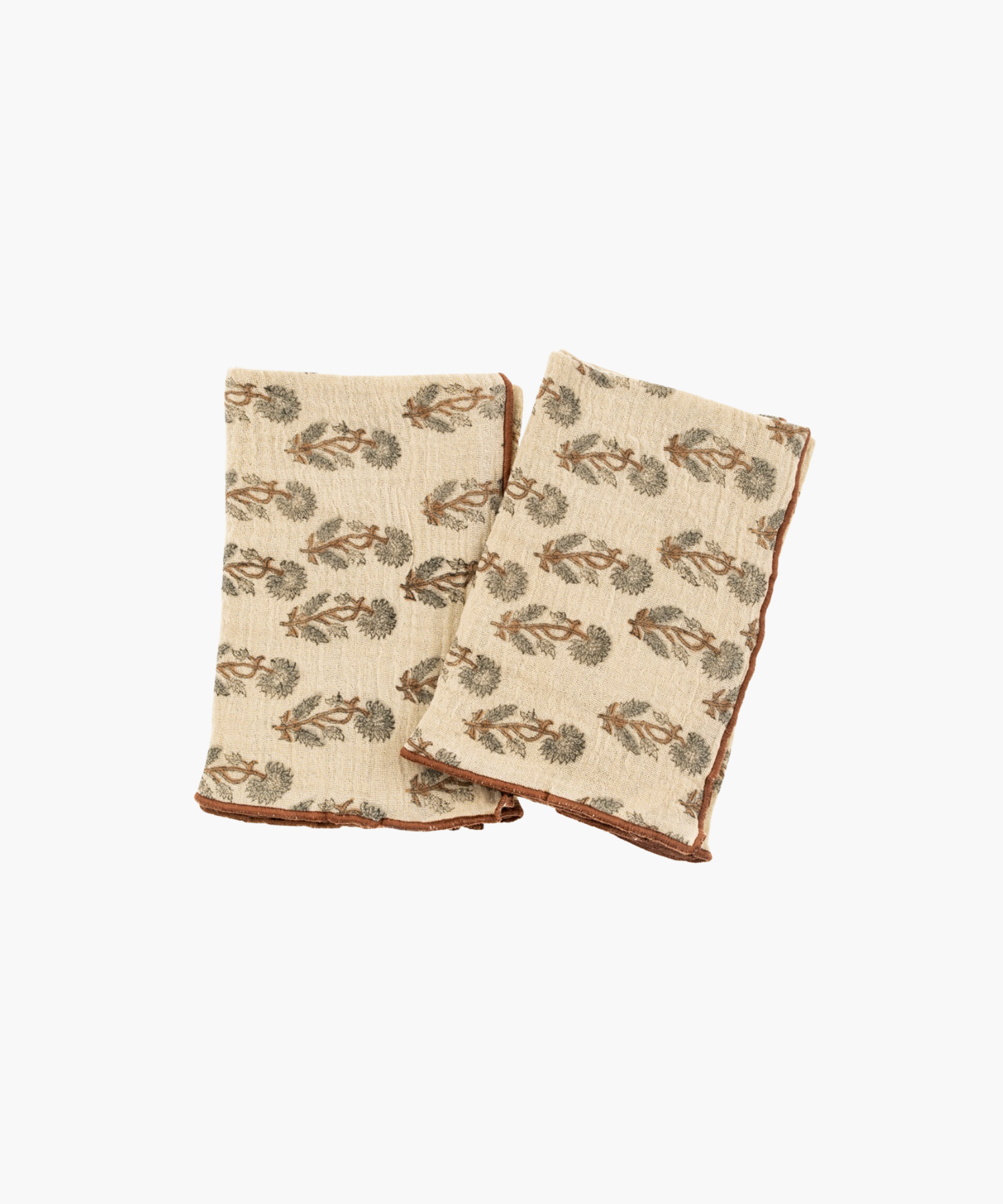 Two beige kitchen towels with brown borders, decorated with a green and brown tree pattern. The fabric appears soft and cozy, evoking a rustic charm.