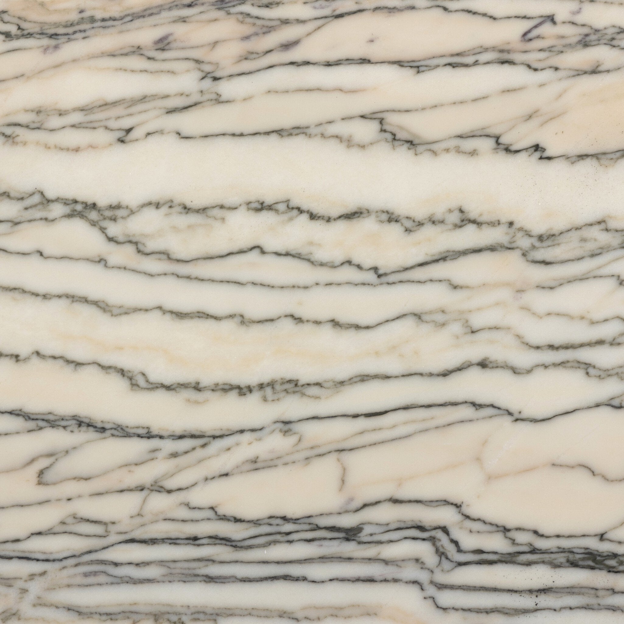 Close up of one of the marble shelves on the nightstand showings its color and stripe like veining. 