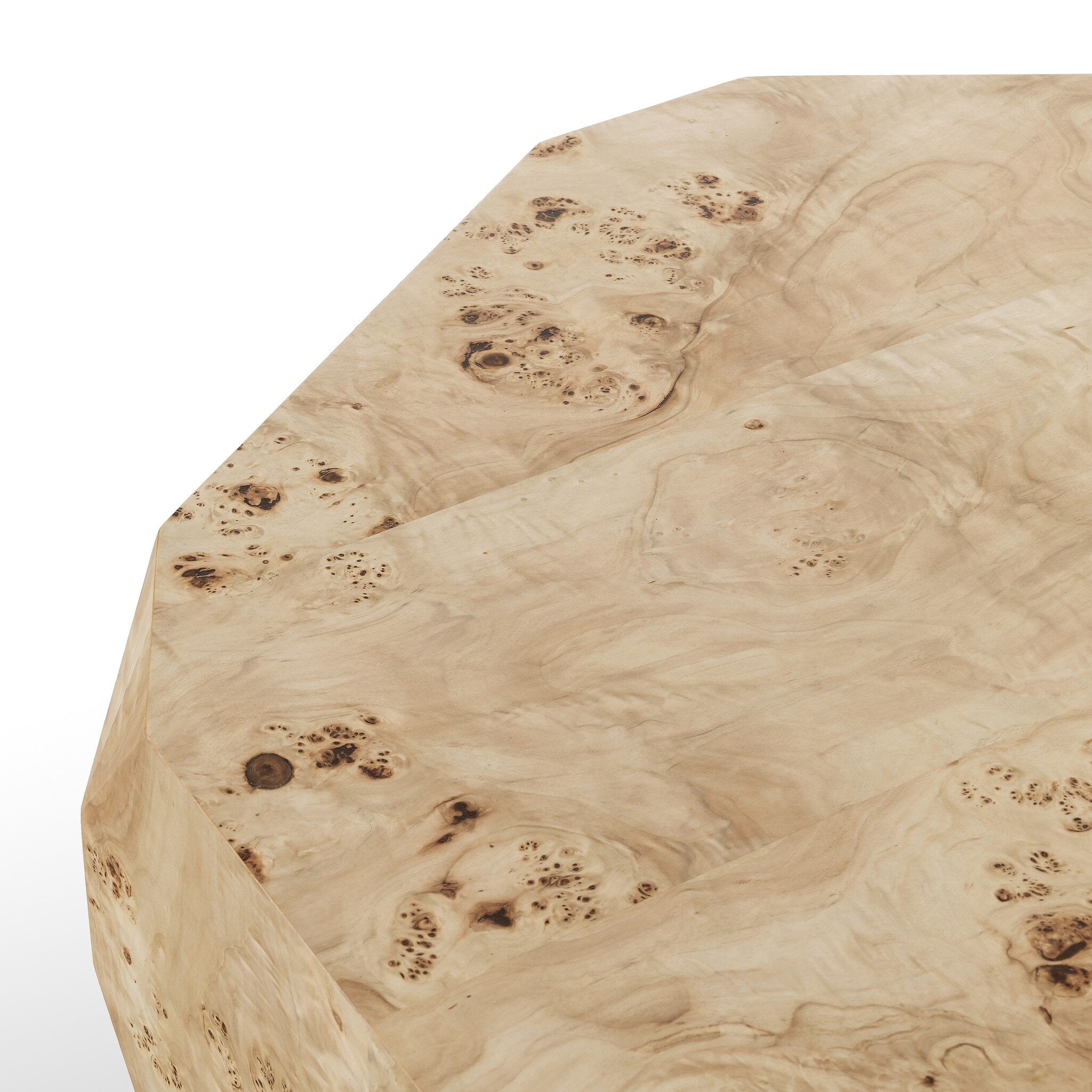 Close up of an organic-looking shaped coffee table with a natural finish on a white background.
