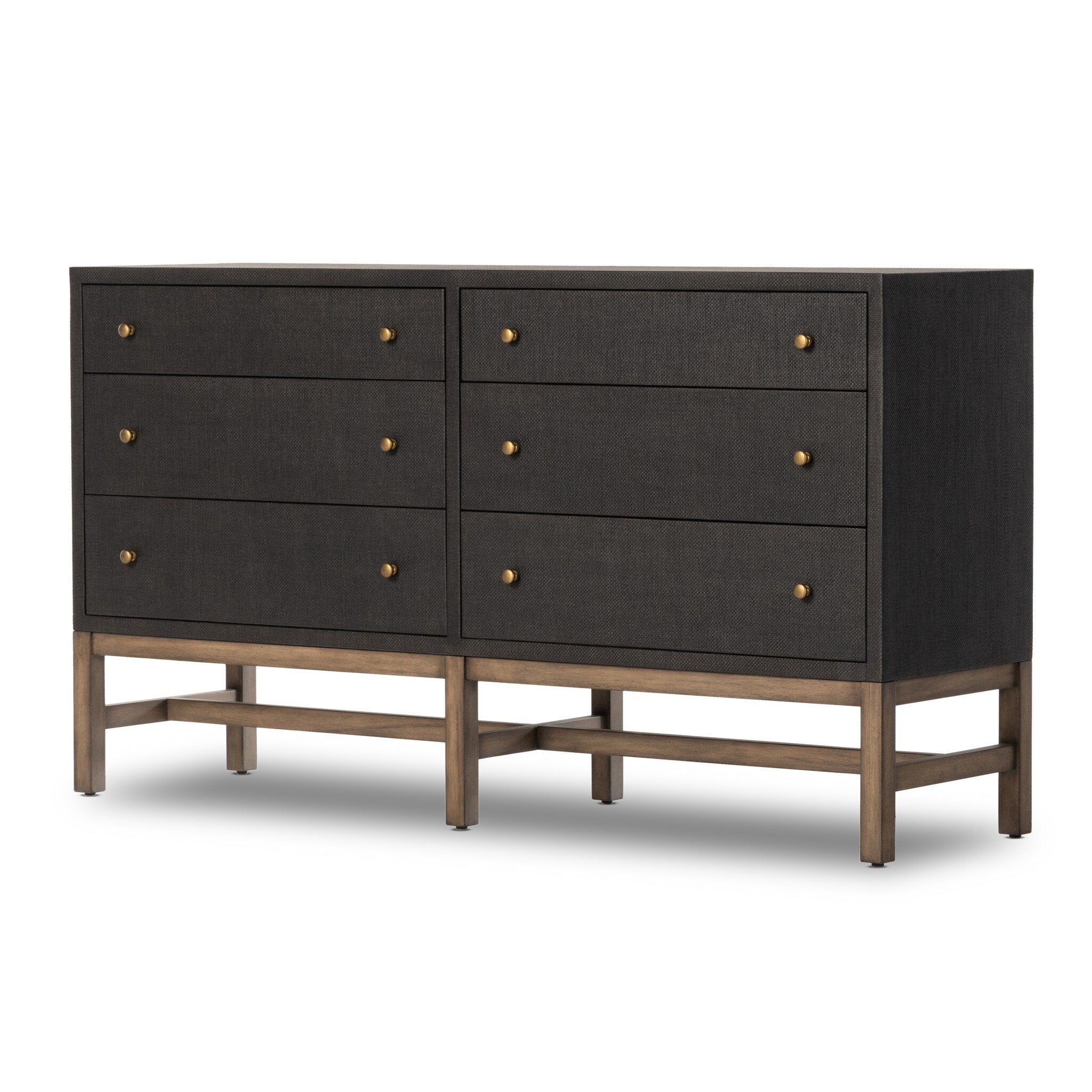 Black dresser with brass knobs with wooden legs on a white background.