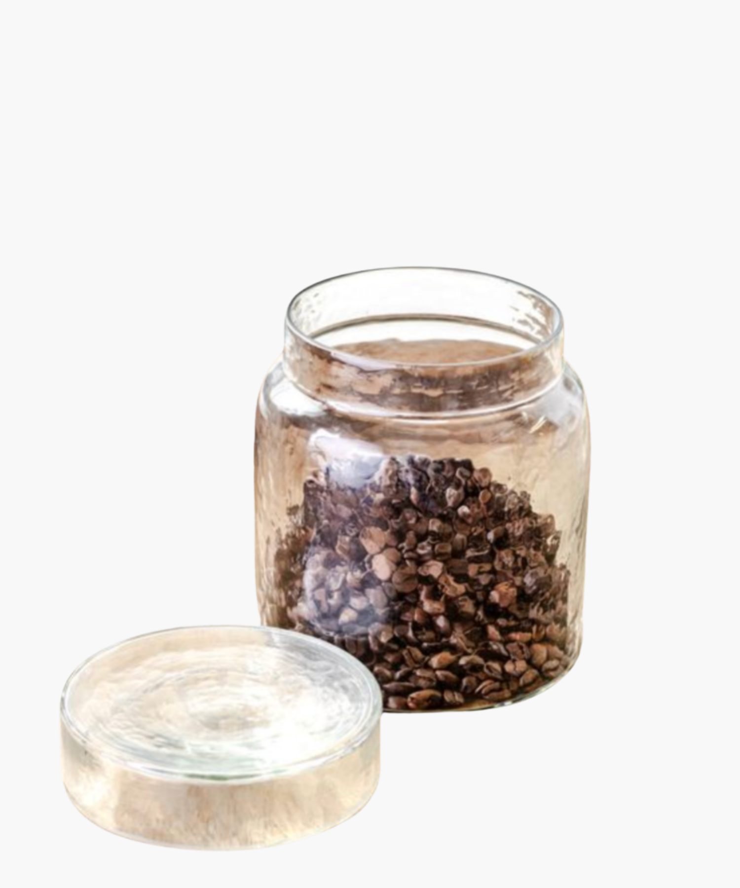A clear glass jar filled with coffee beans against a white background. The scene conveys simplicity and vintage charm.
