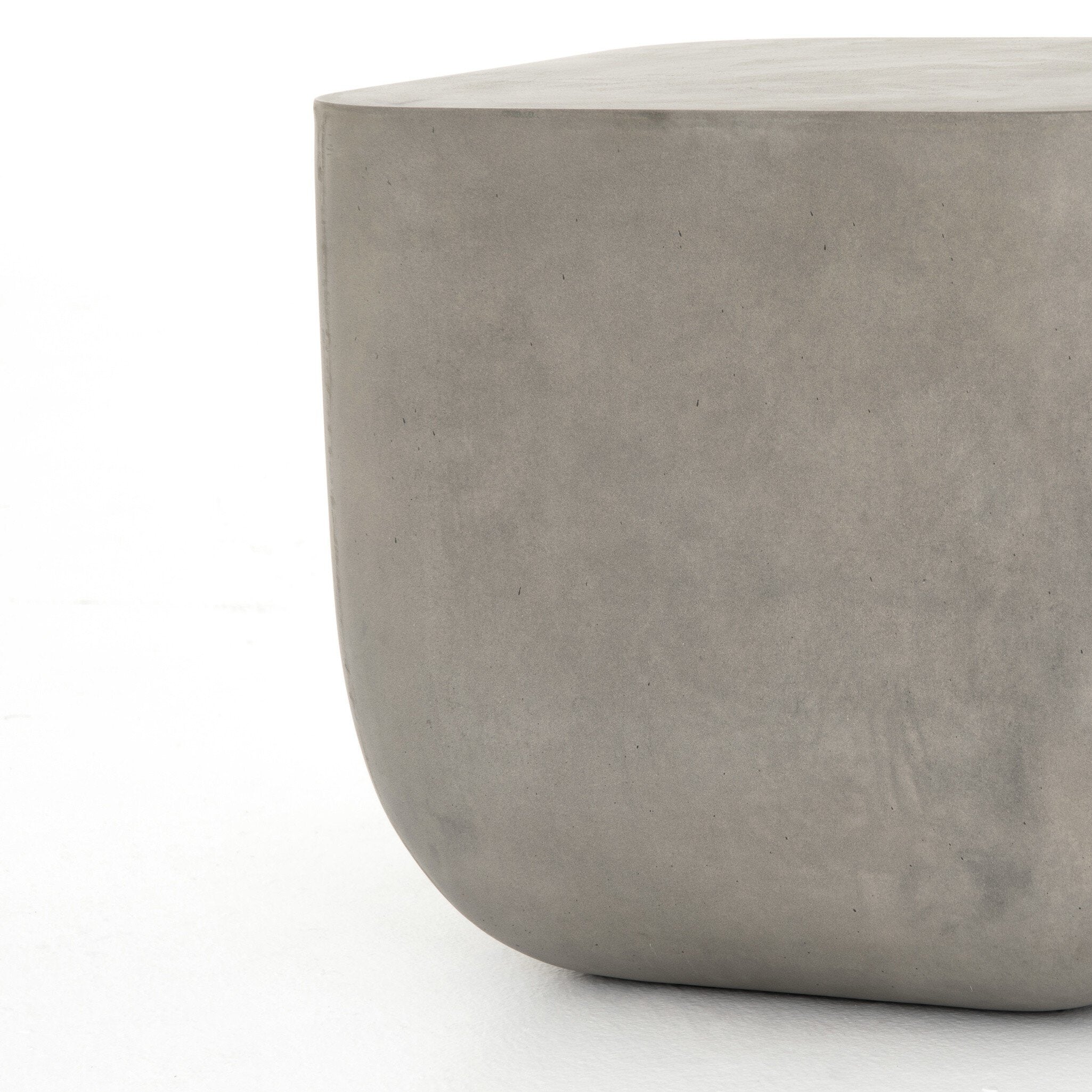 Grey-finished concrete and soft square shaped end table on a white background. 