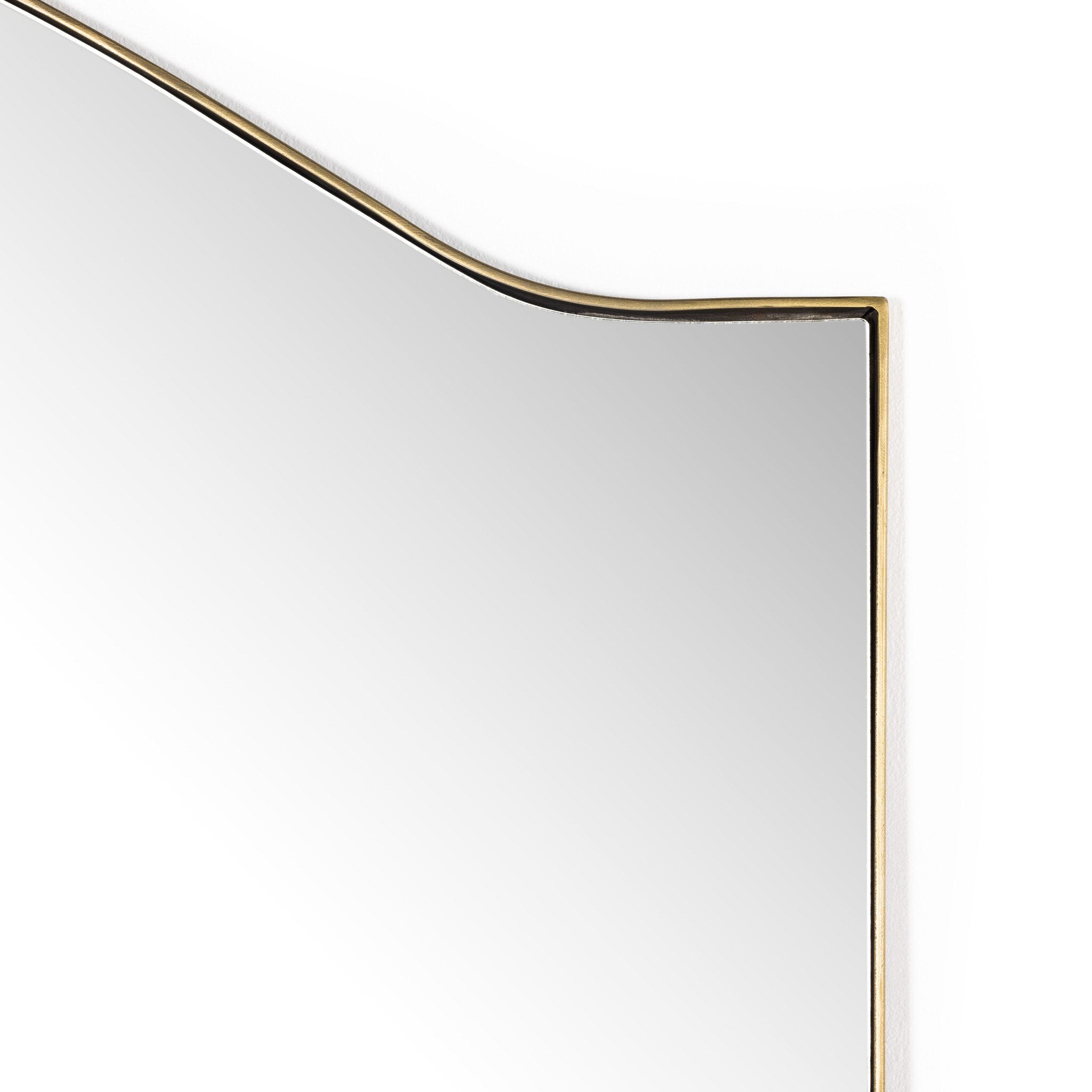 Rectangular floor length mirror with curved detail and a gold frame on a white background.
