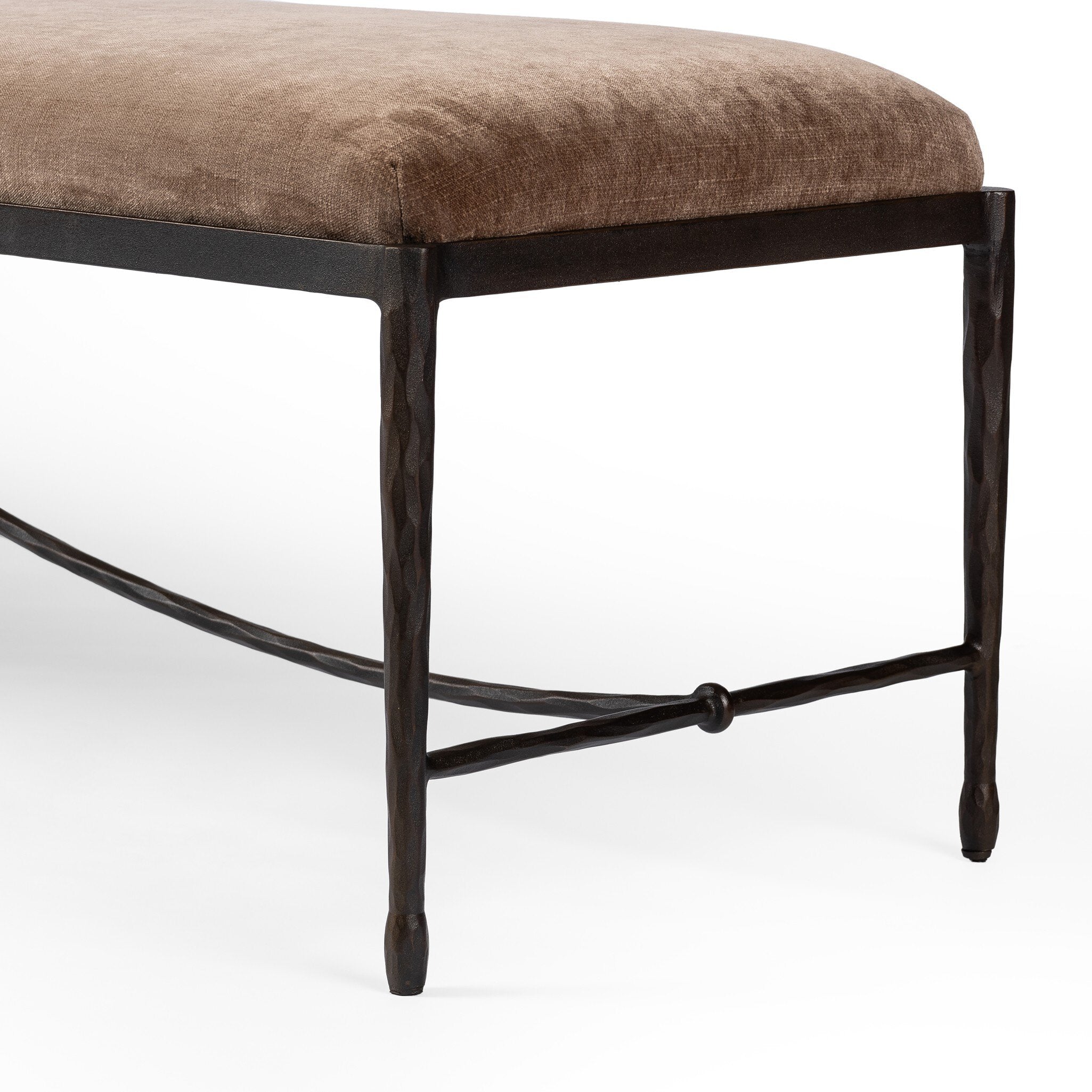 Brown upholstered bench with black metal frame on a white background