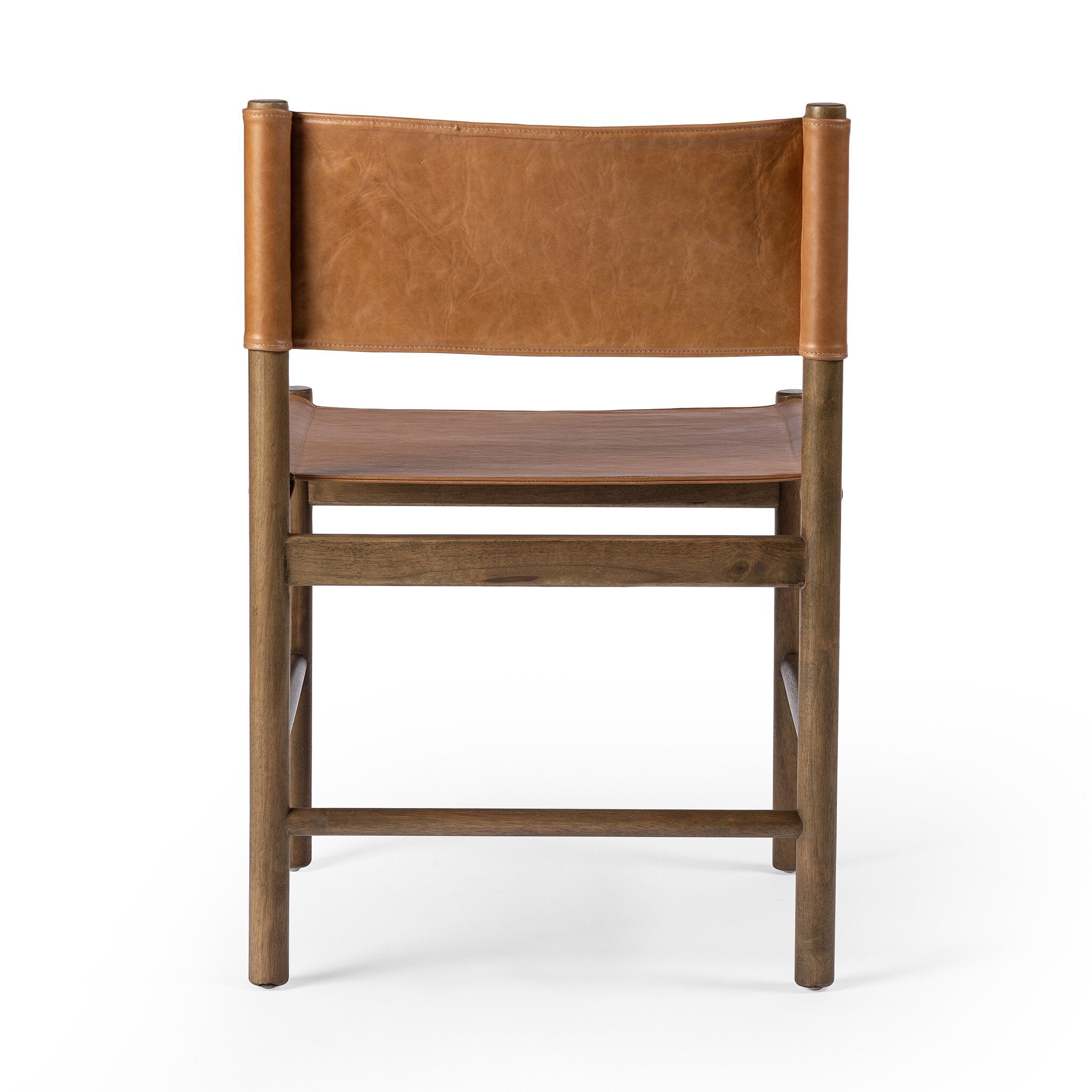 The back of a brown wooden chair with sling-style leather seating on a white background.