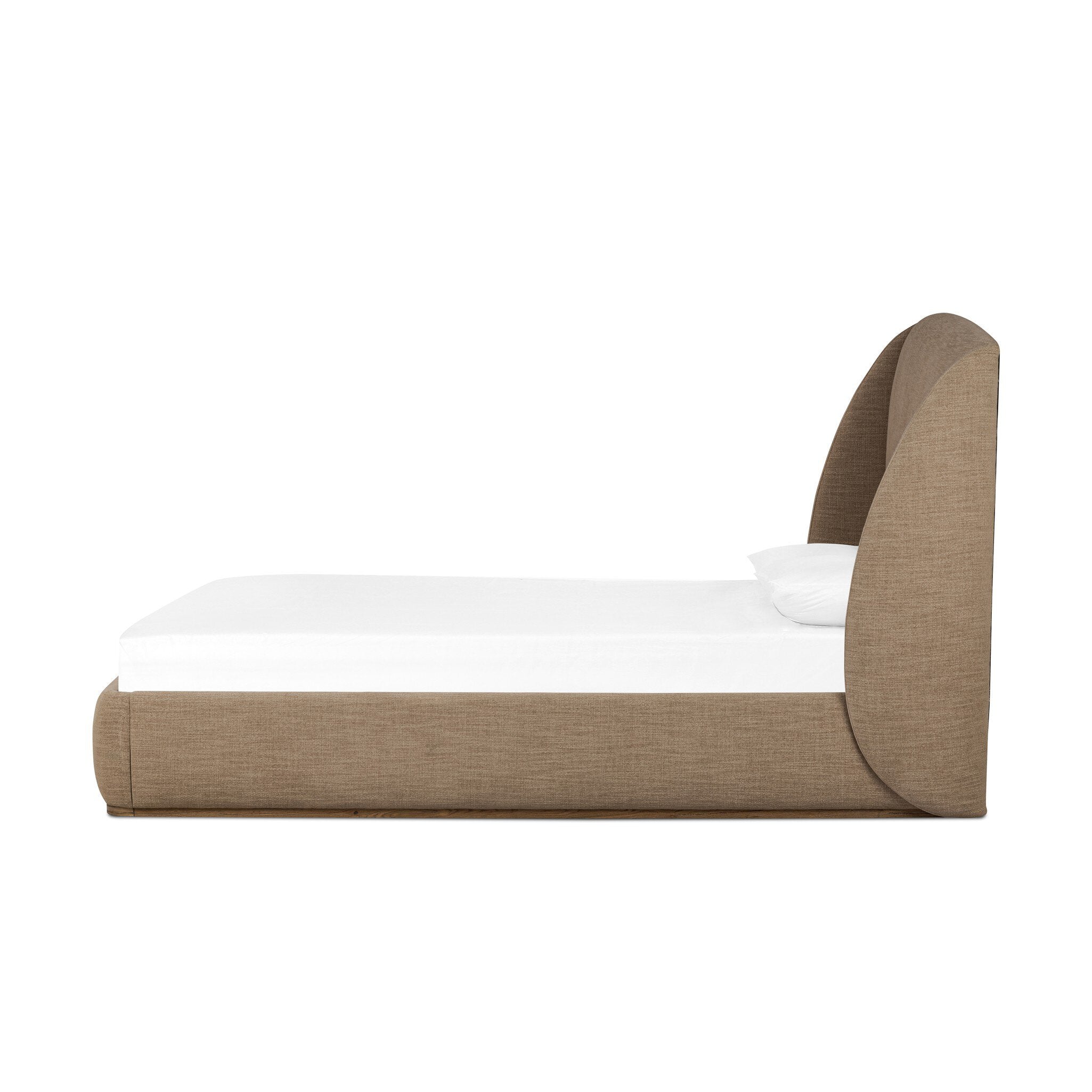 Side profile of a taupe upholstered bed with white bedding on a white background.