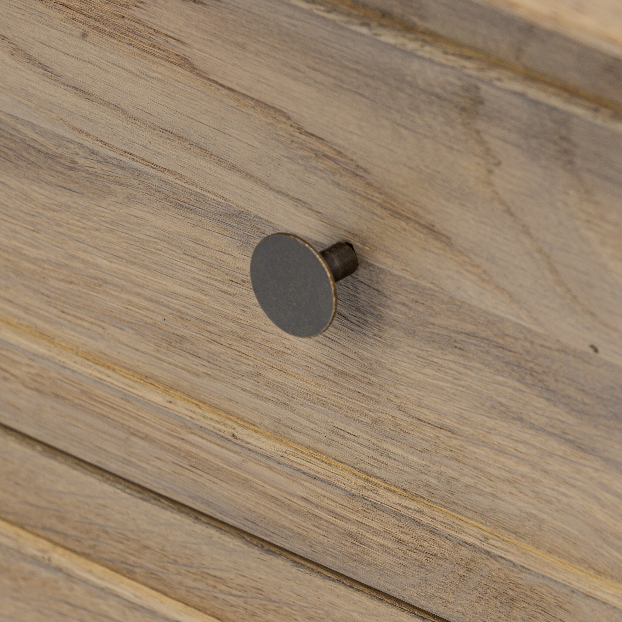 Close up of a wooden nightstand with two drawers on a white background.