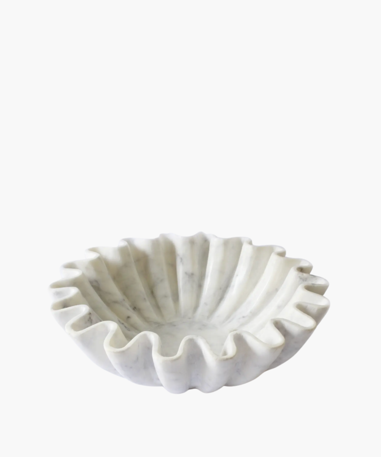 A white, wavy marble bowl with a ruffled edge, resembling a flower. The smooth texture and elegant design convey a sense of sophistication.
