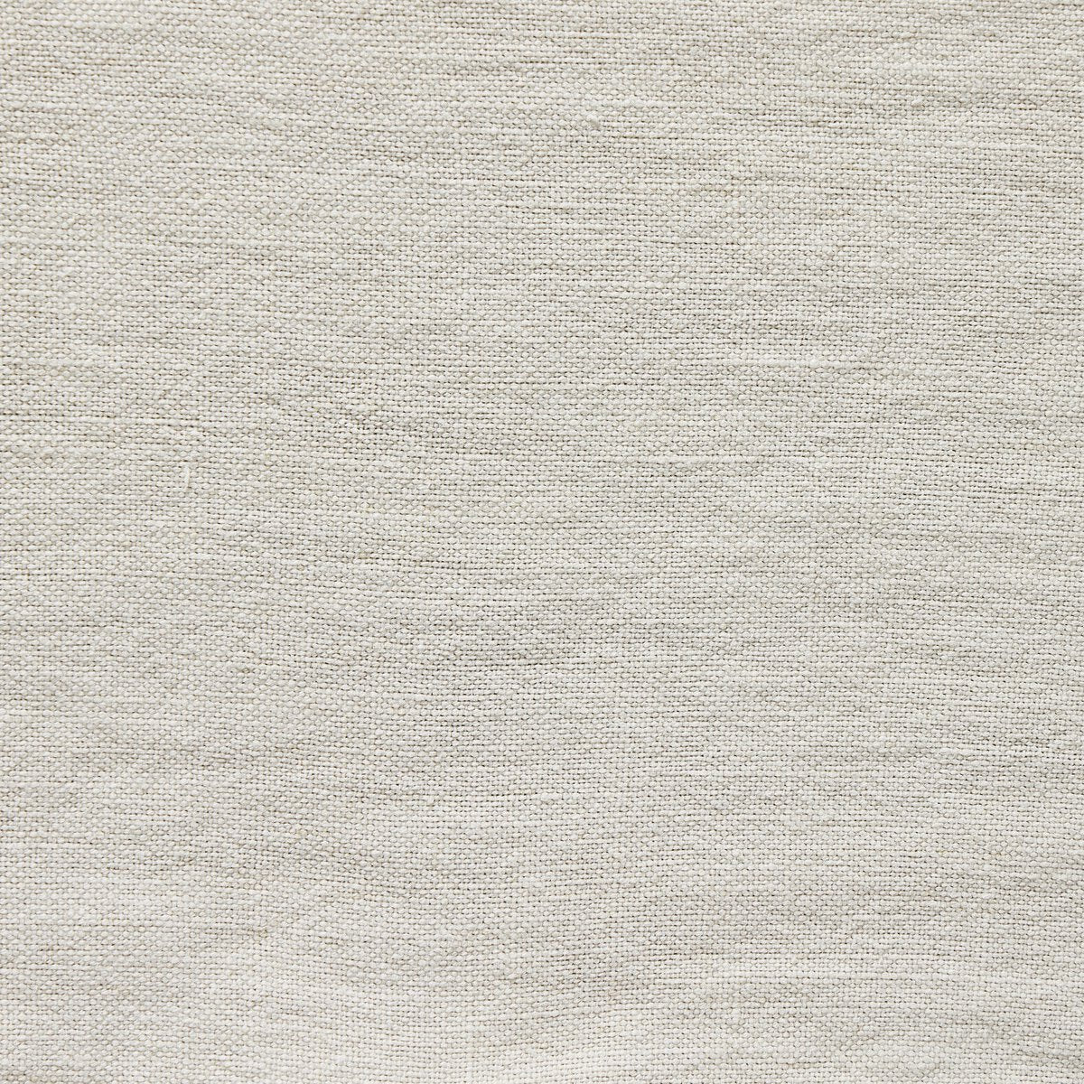 Close up of a white bed with a matching headboard on a white background.