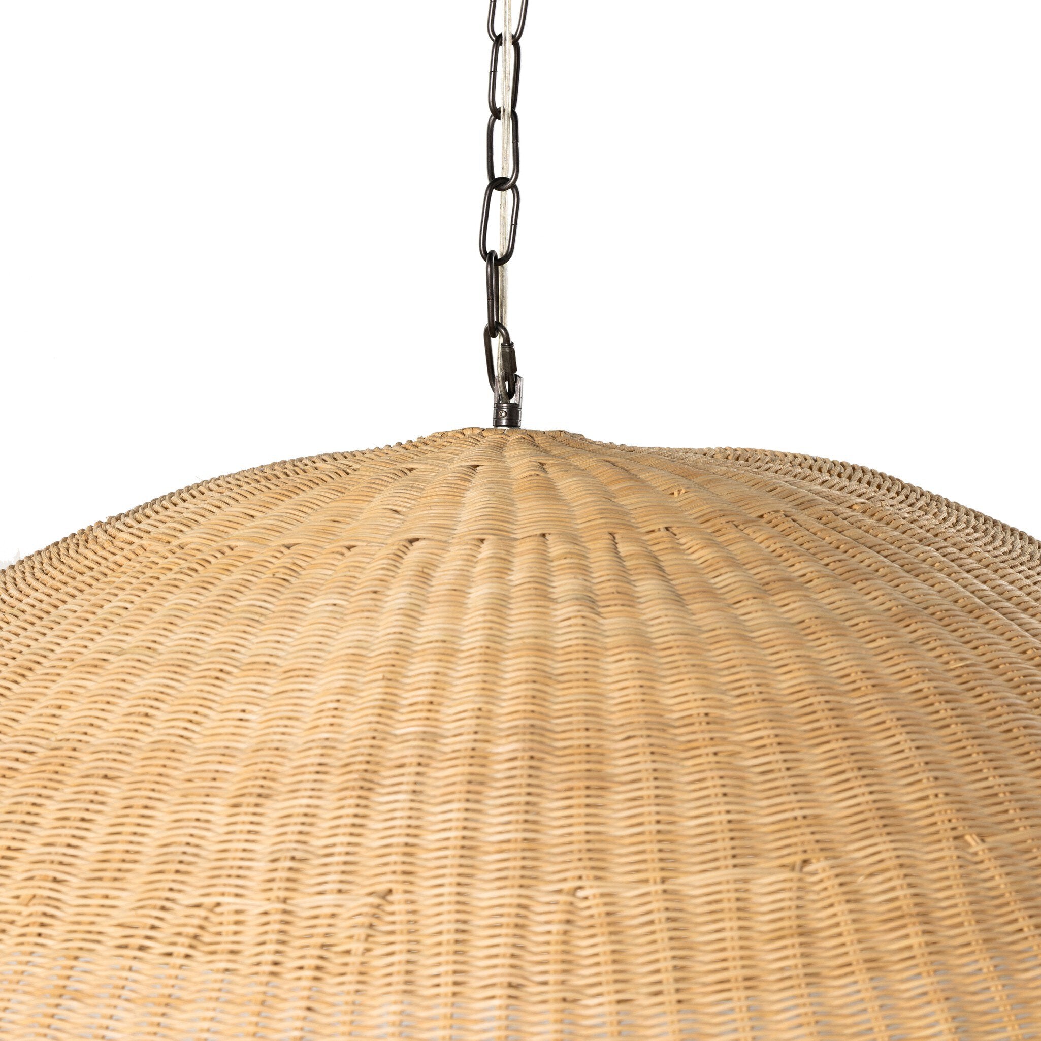 Close up view of a wicker pendant light with a chain on a white background.