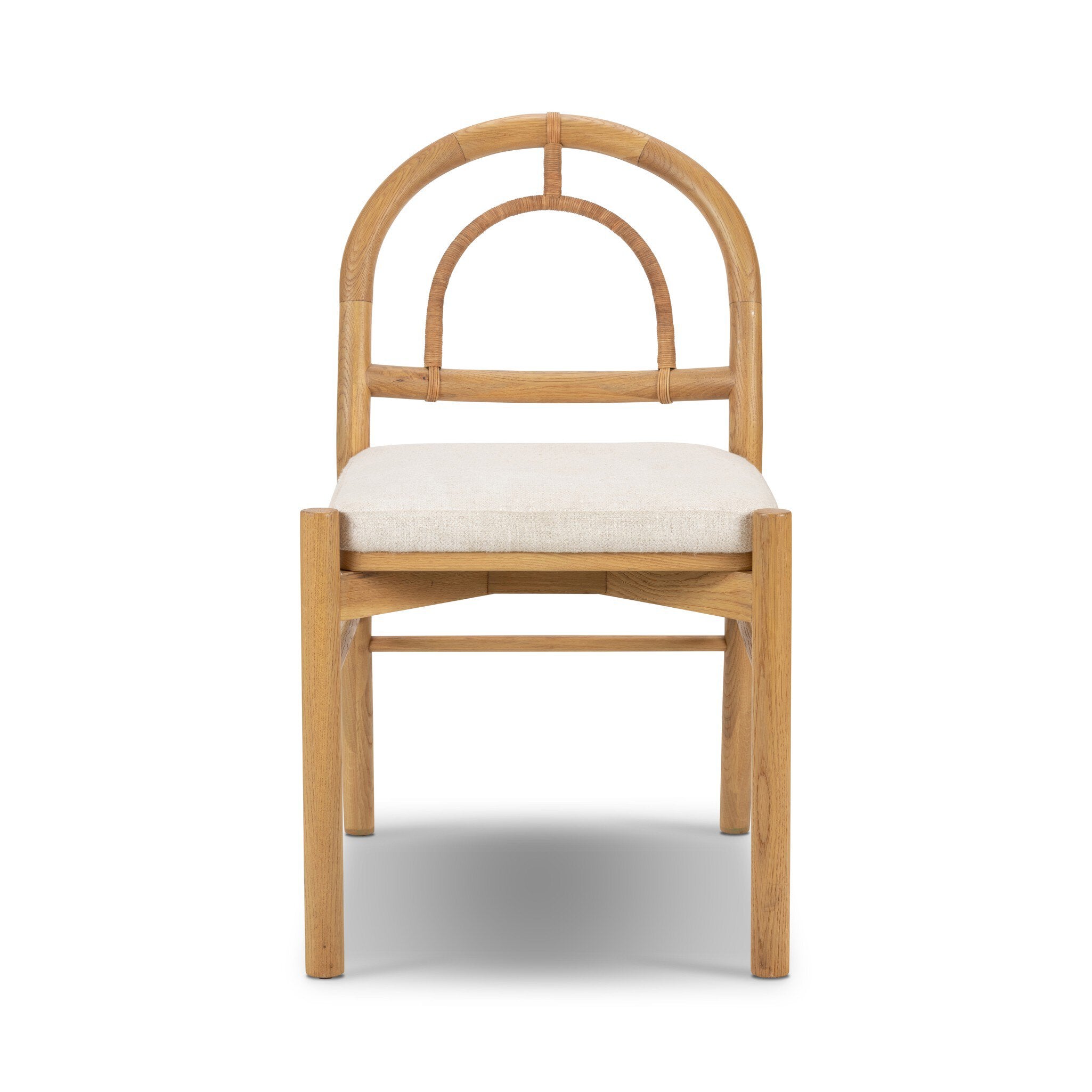Solid oak dining chair with an arched frame, hand-wrapped cane back detailing, and an upholstered drop-in seat. 