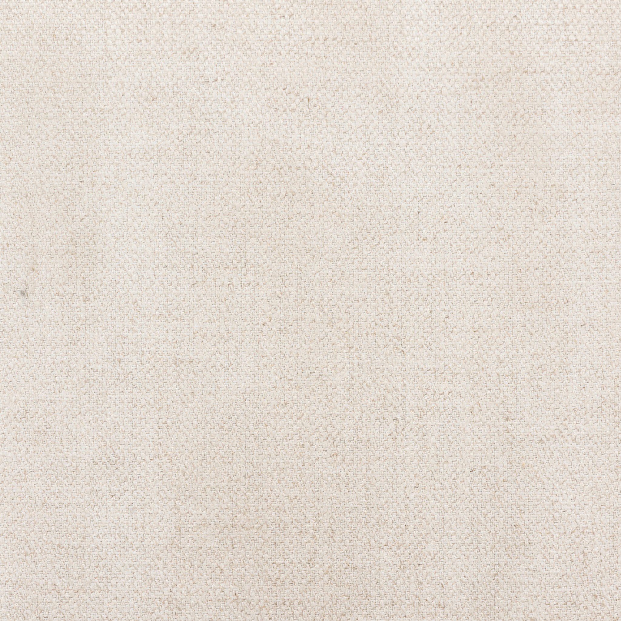 Close up of a solid oak dining chair with an arched frame, hand-wrapped cane back detailing, and an upholstered drop-in seat. 