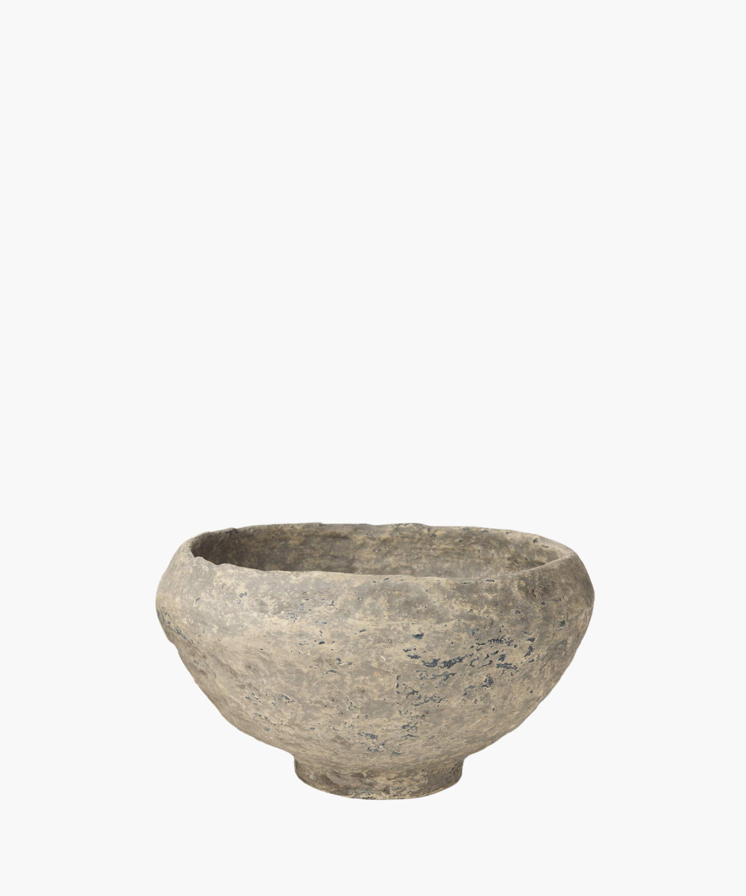 A rustic, paper mache bowl with a textured surface, showcasing shades of gray and subtle patches of darker tones. The bowl exudes an ancient, historical feel.