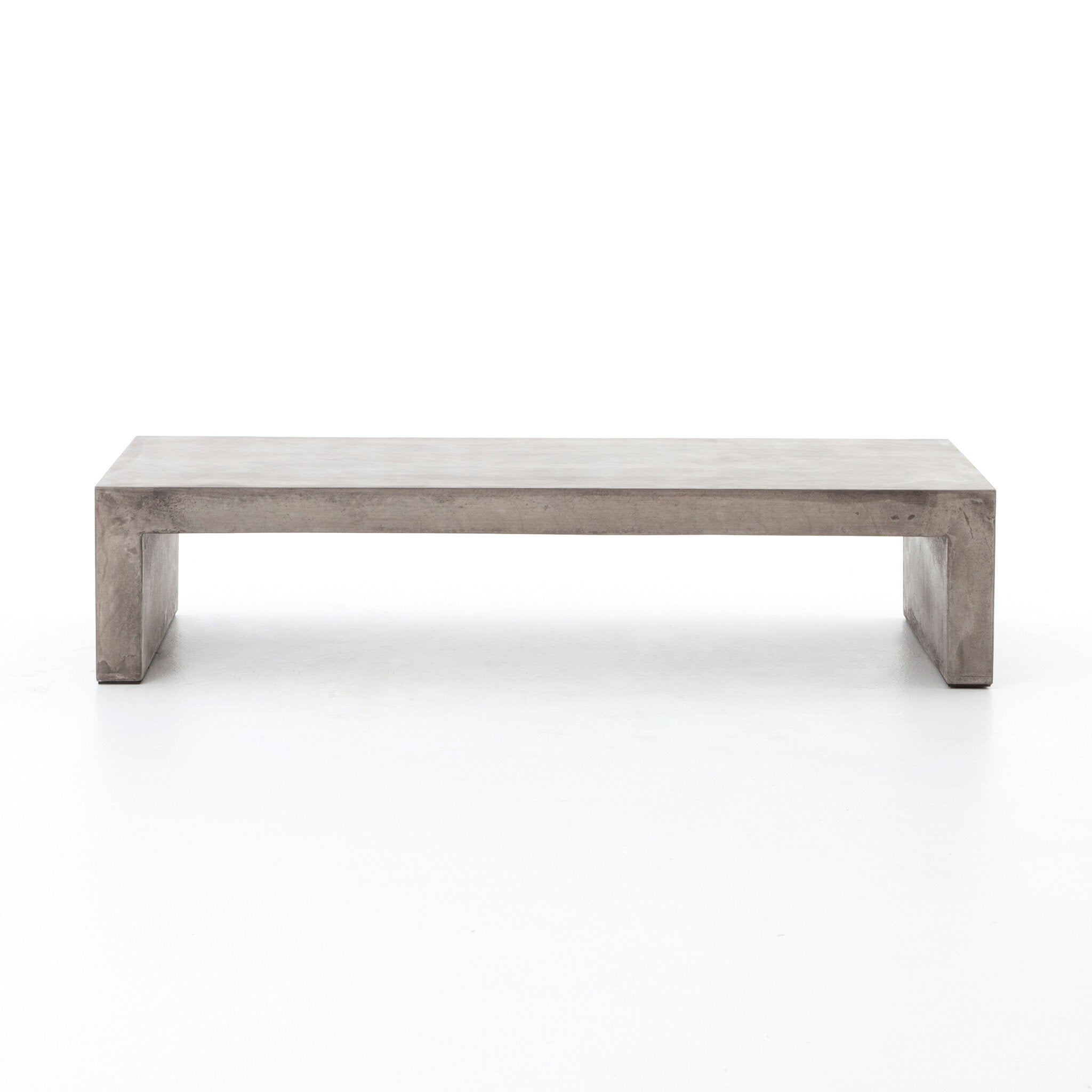 Dark grey concrete waterfall coffee table on a white background. 