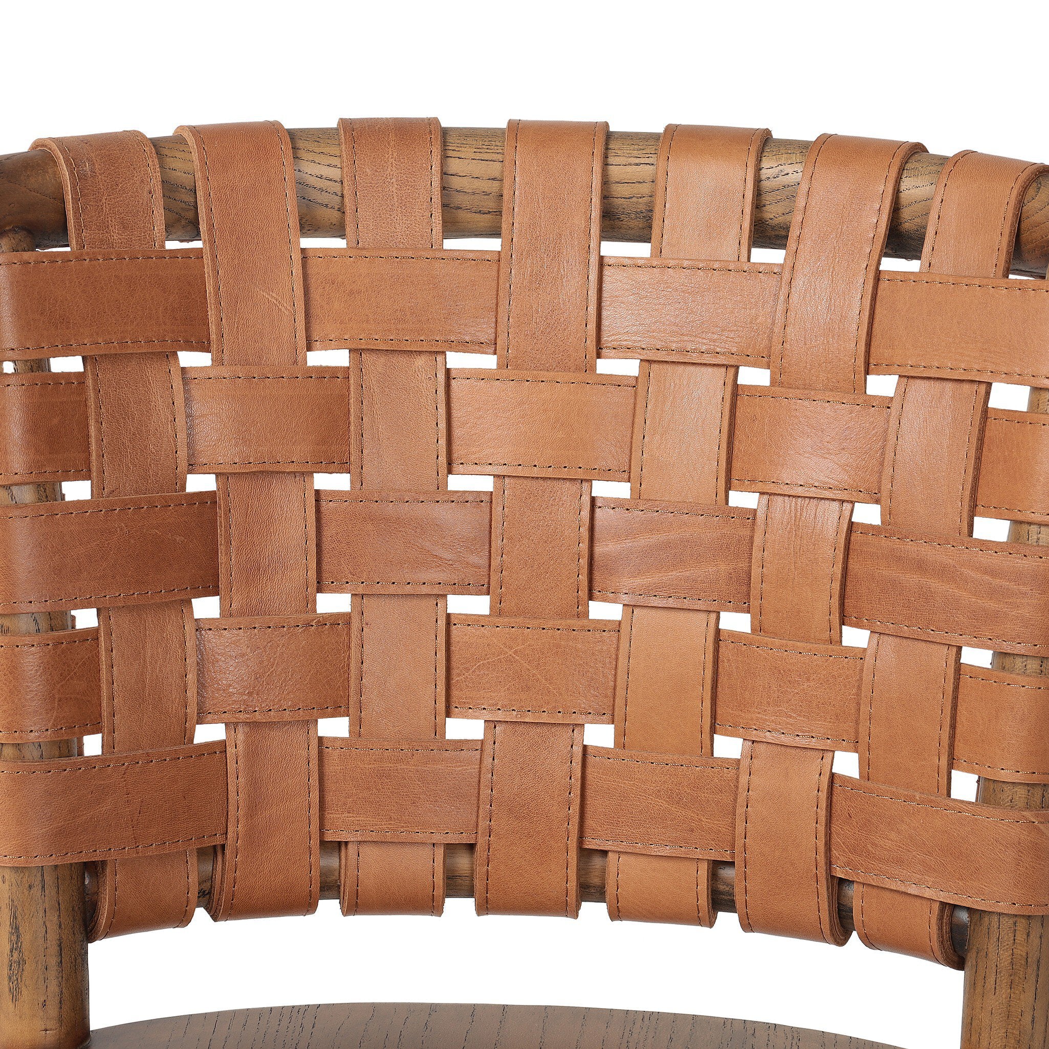 Close-up of woven brown leather seat on a chair with a white background