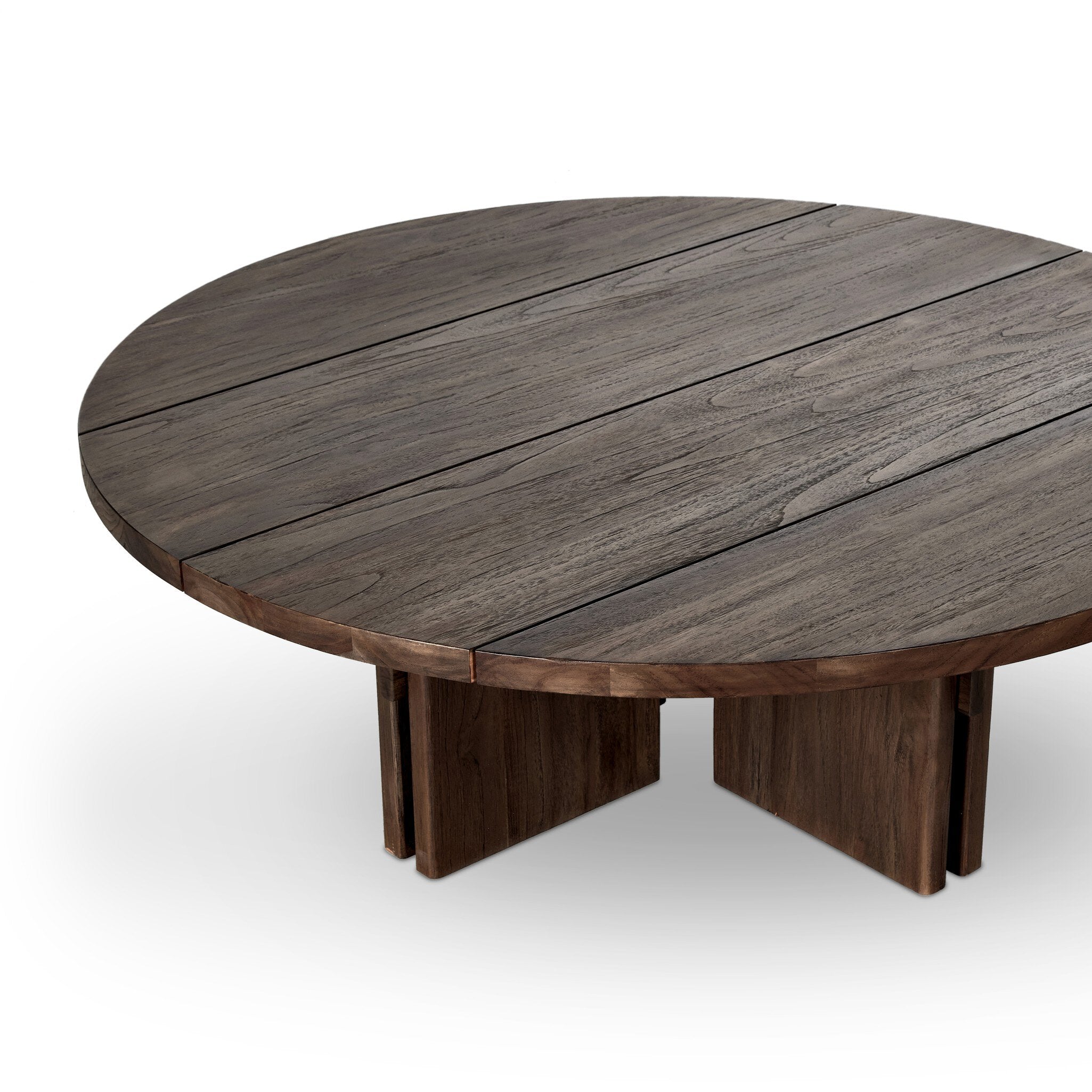 Solid teak round coffee table on a white background.