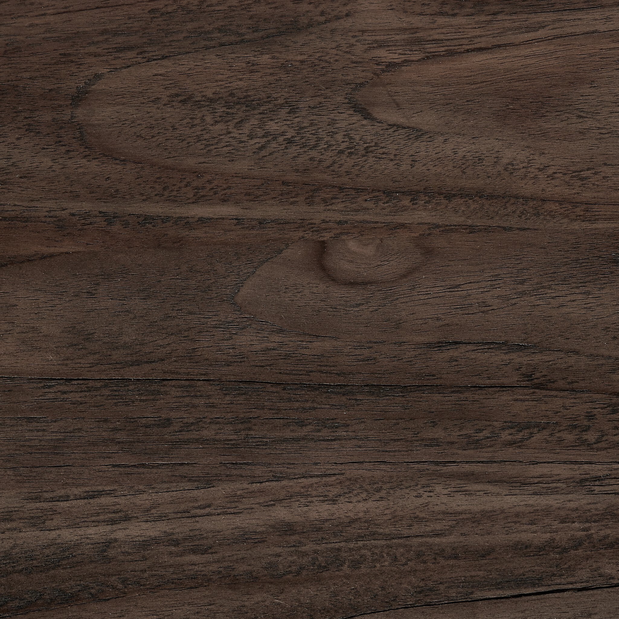 Close up of the solid teak coffee table showing color and grain pattern. 