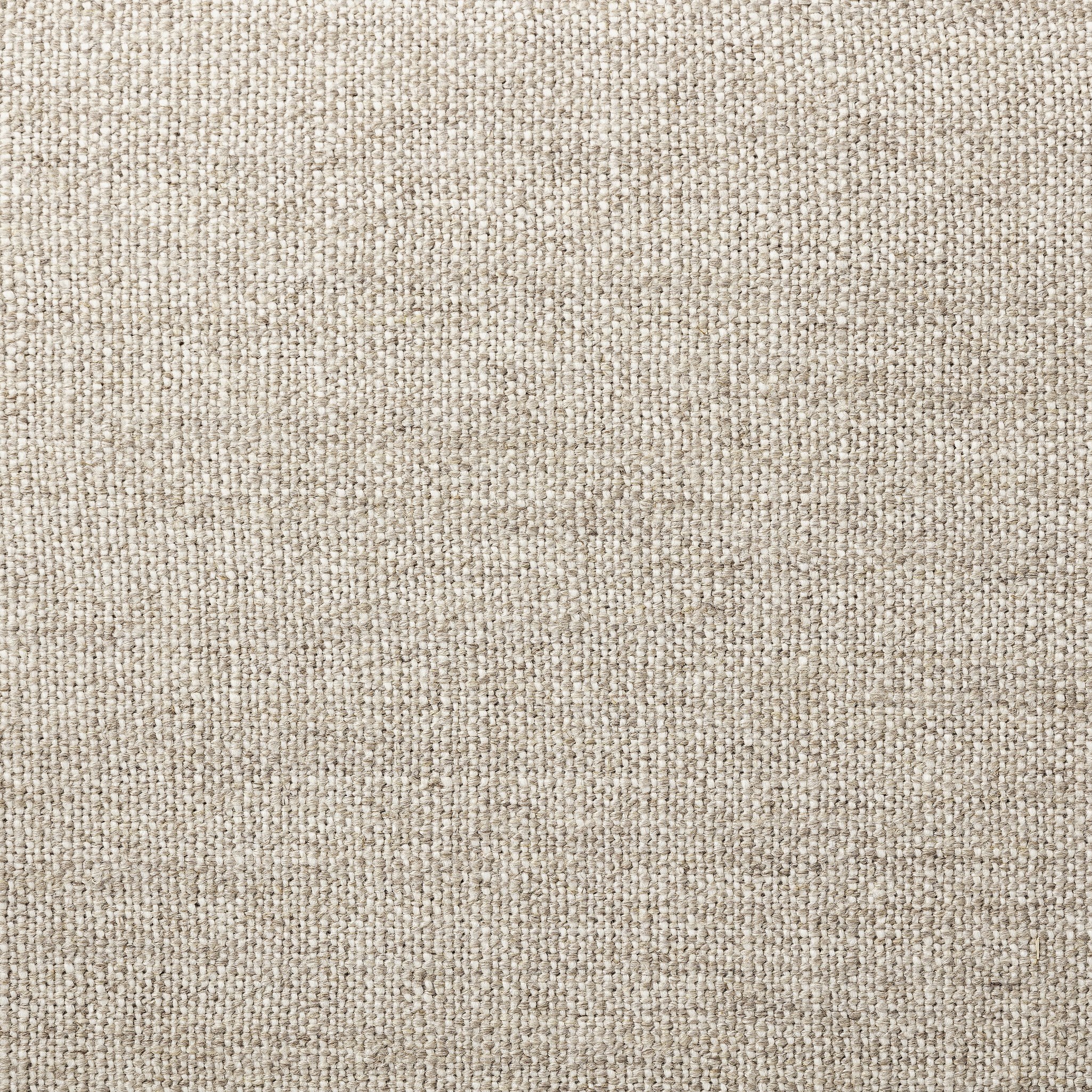 Close up of a dining chair with woven backrest and upholstered seat on a white background.