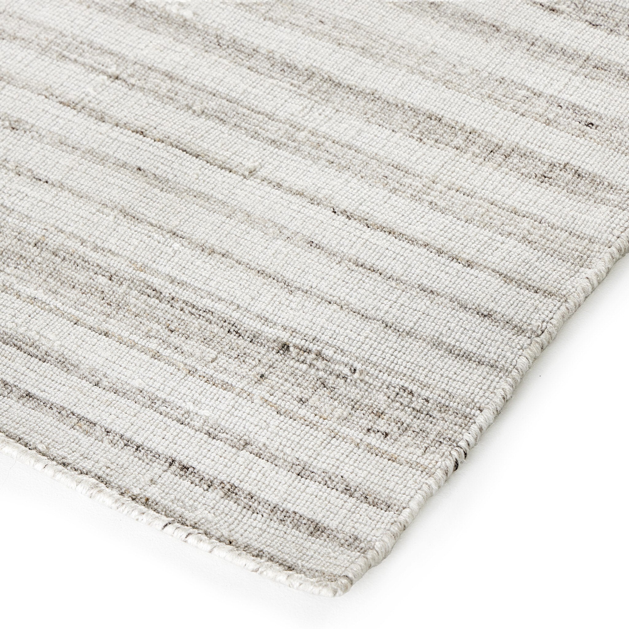 Rectangular rug with a striped pattern on a white background.