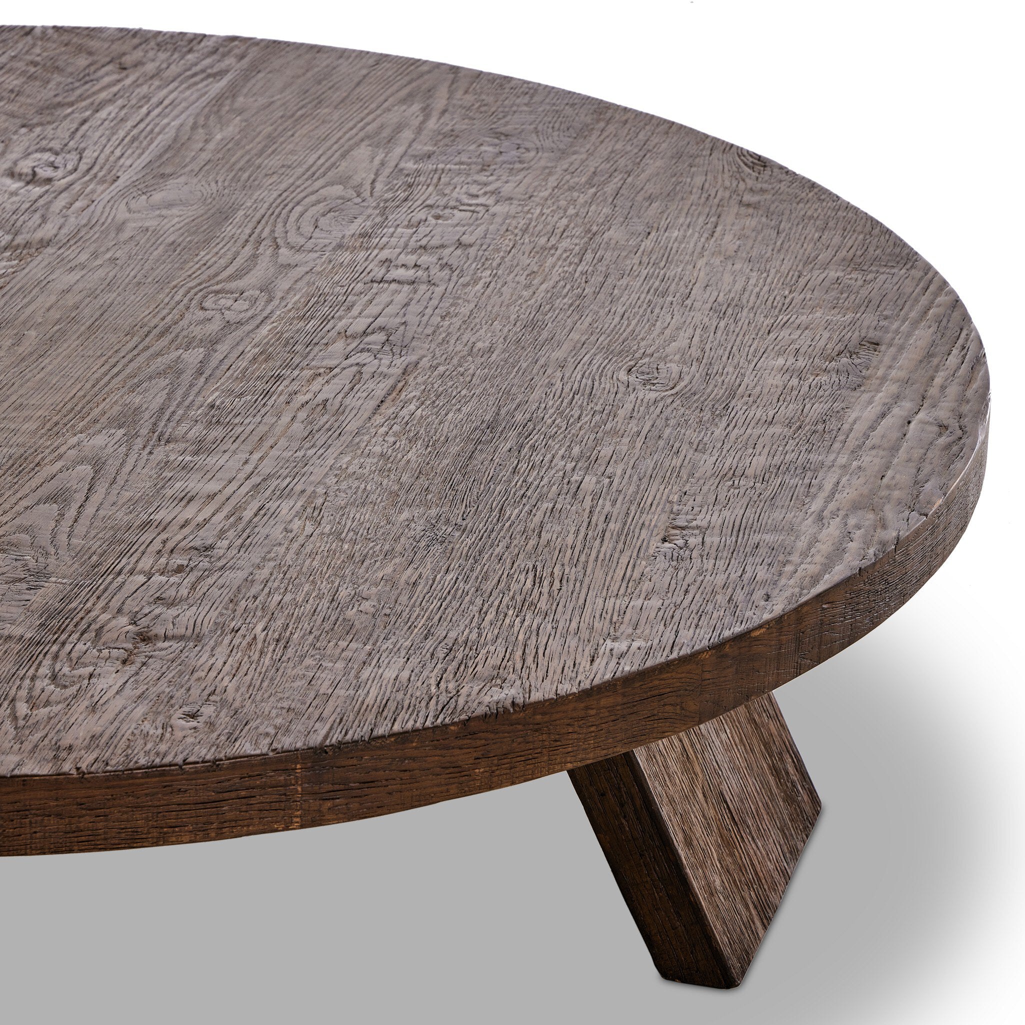 Round wooden coffee table on a white background.