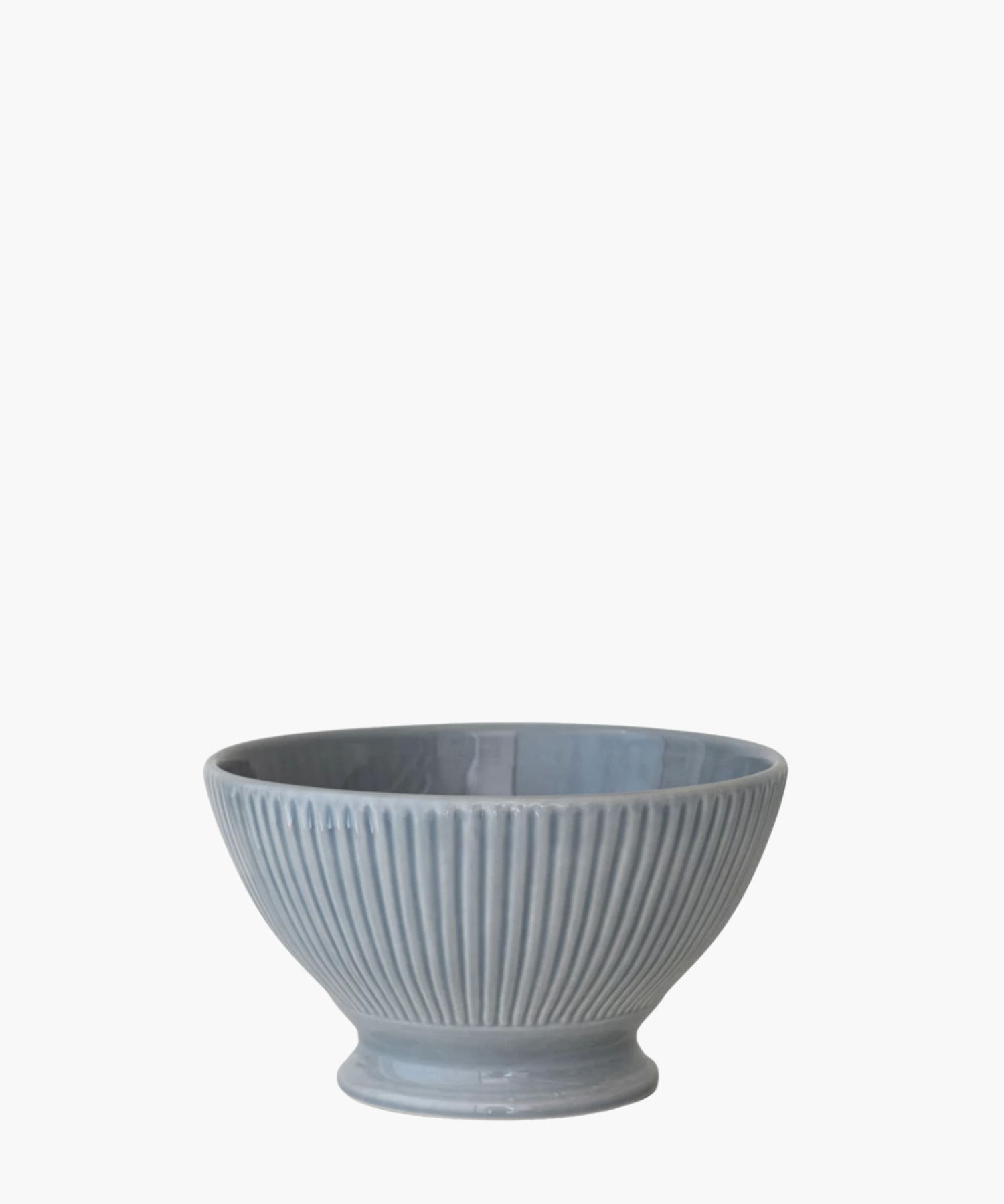 A ribbed, light blue ceramic bowl with a wide top and narrow base is centered against a white background, conveying a simple and elegant tone.