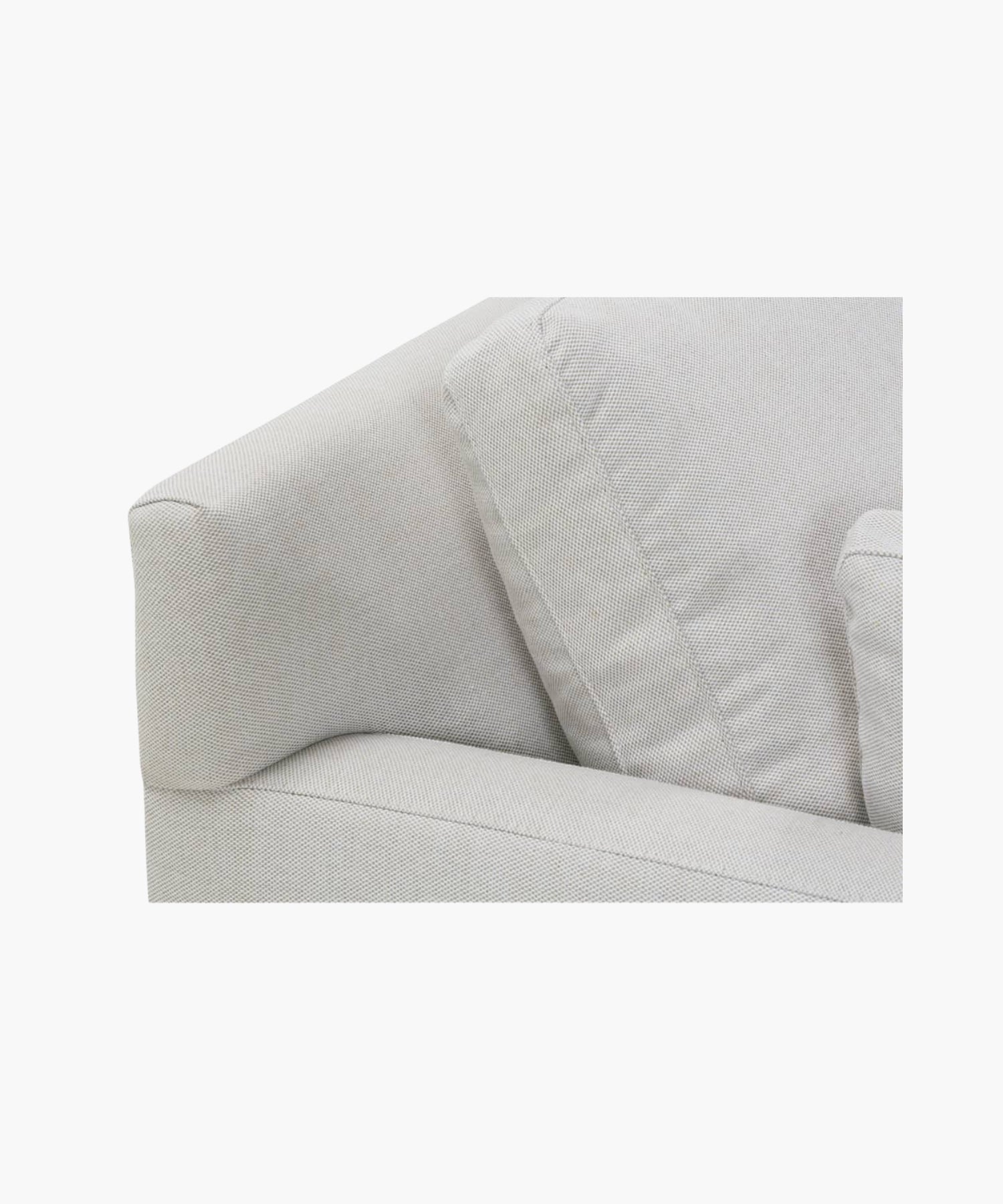Close up of a gray sofa on a white background.