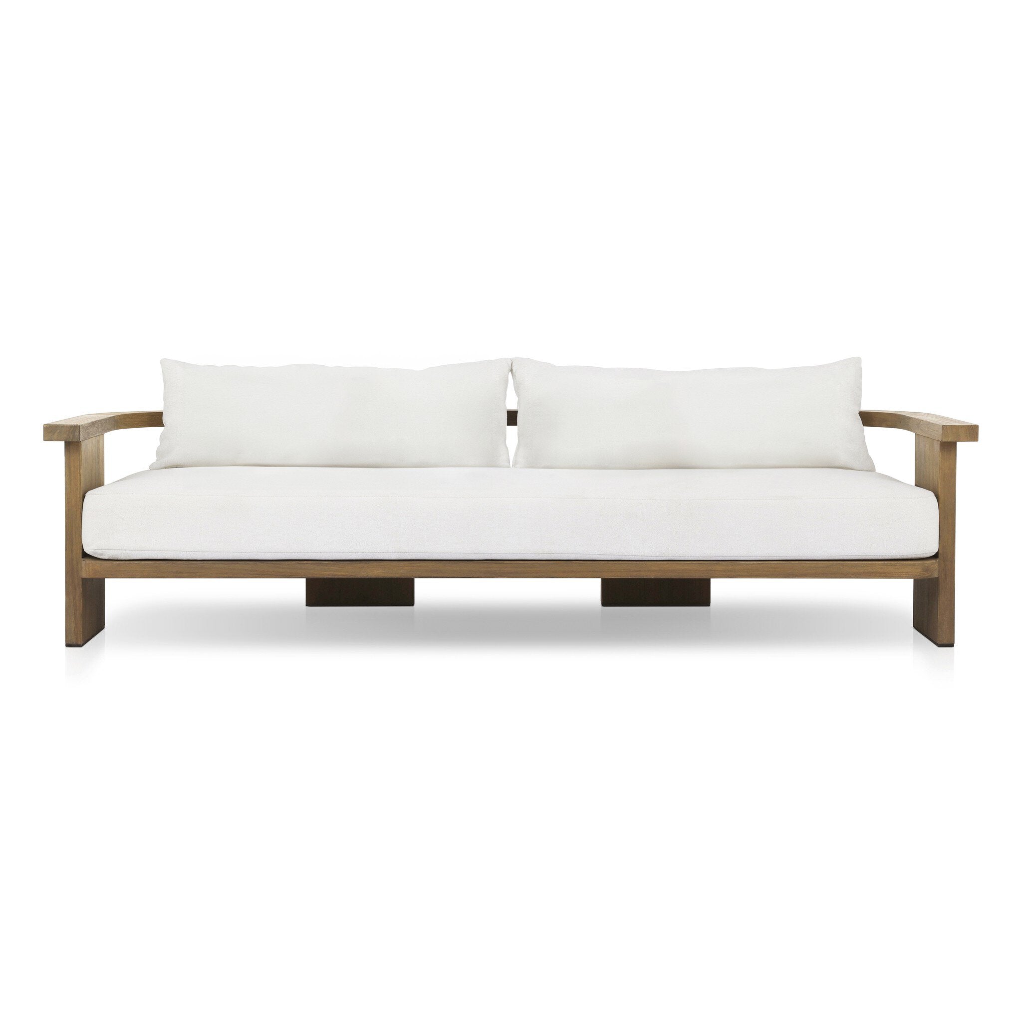 Outdoor sofa with curved wooden frame out of teak and white linen cushions on a white background.