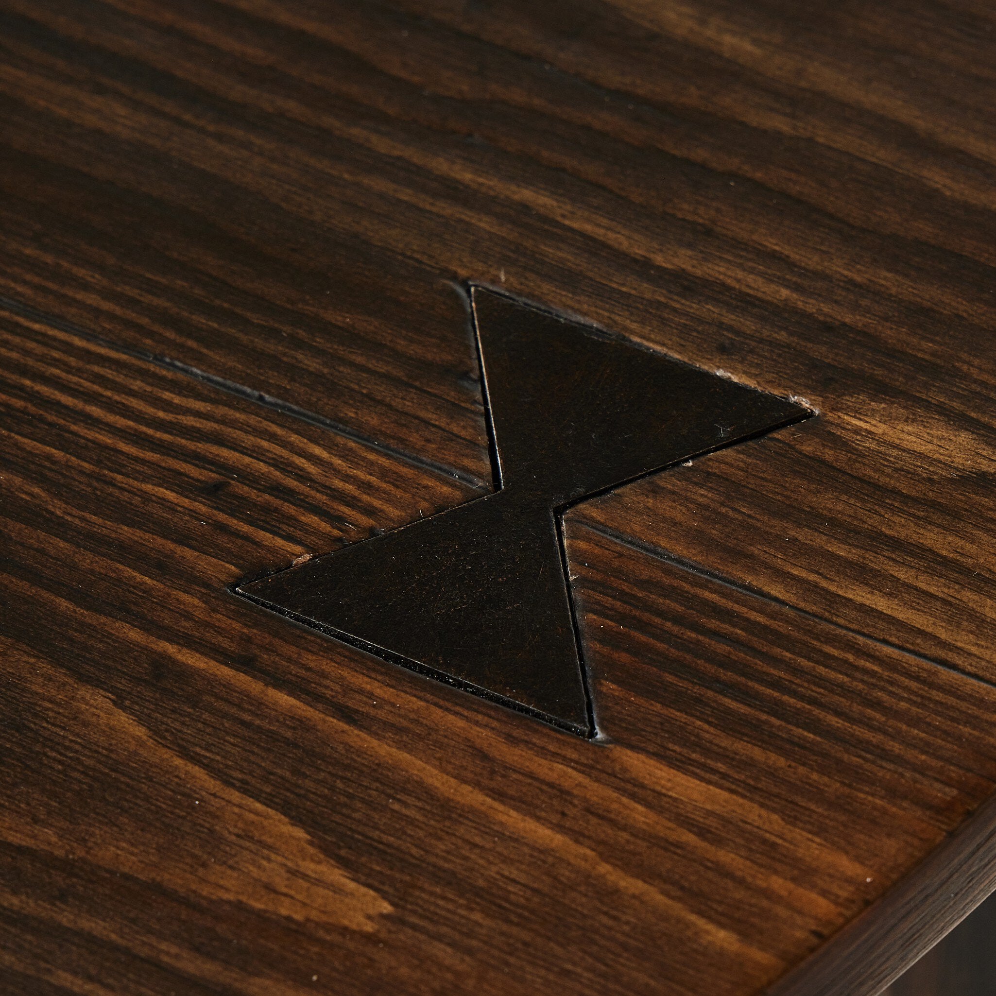 Close up of the brown-finished pine showing its rich color and graining. 