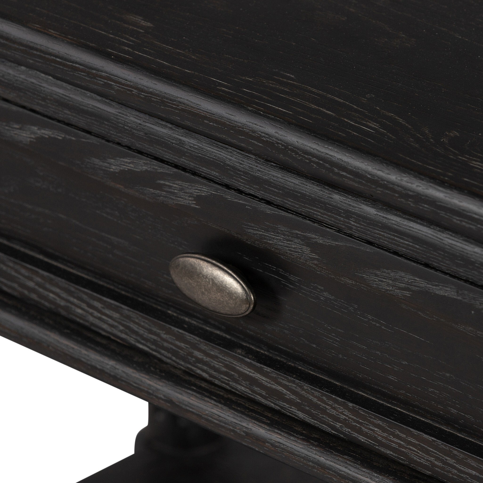 Close-up of a dark wooden drawer with a metal handle on a white background