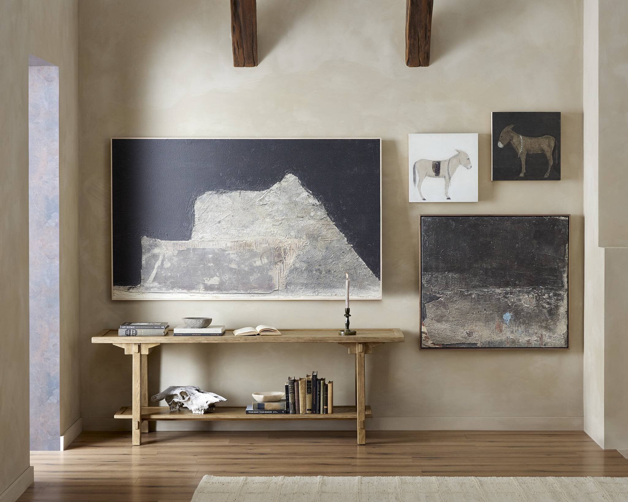 Modern interior with a wooden console table and wall art
