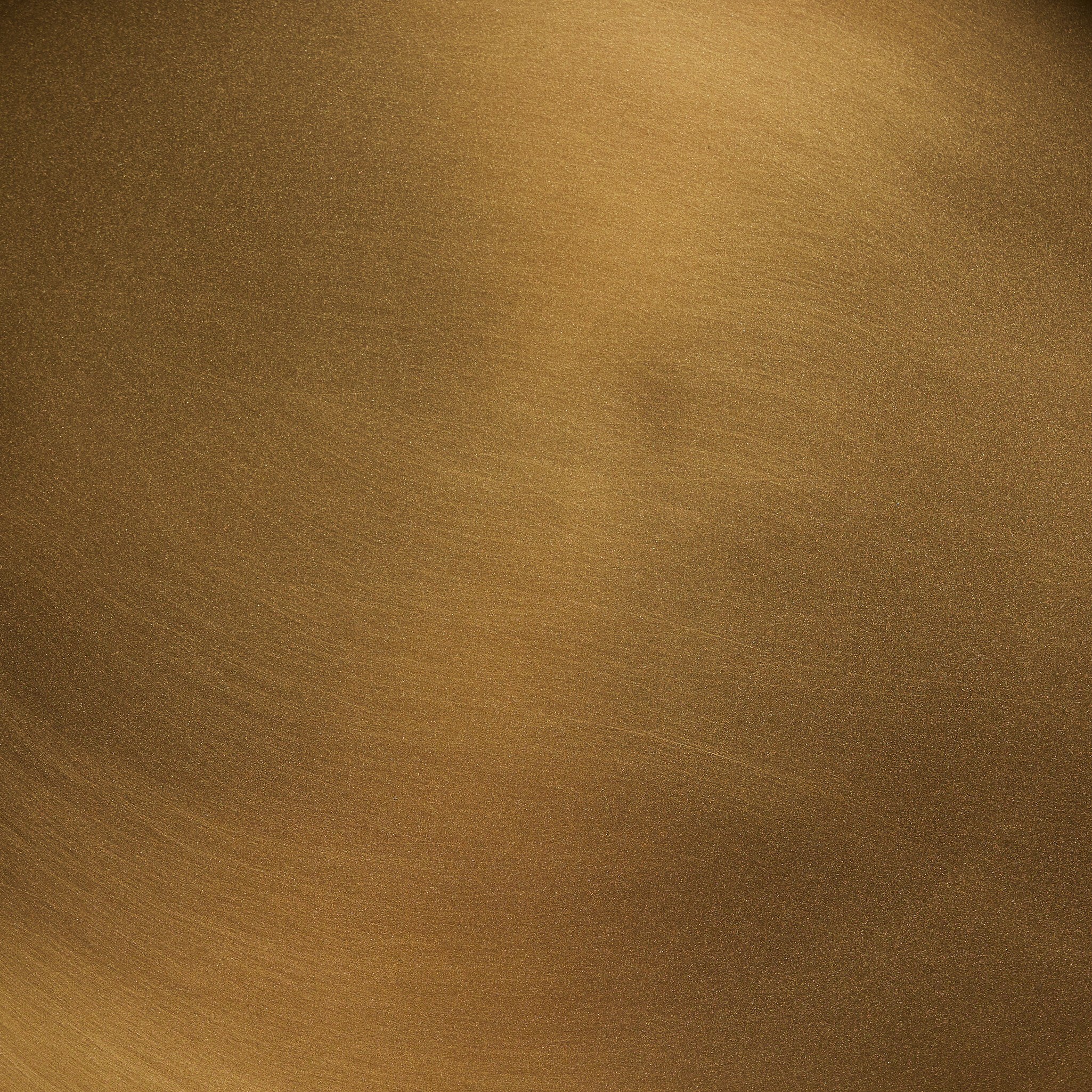 Close-up of the brass end table showing its matte finish and texture.