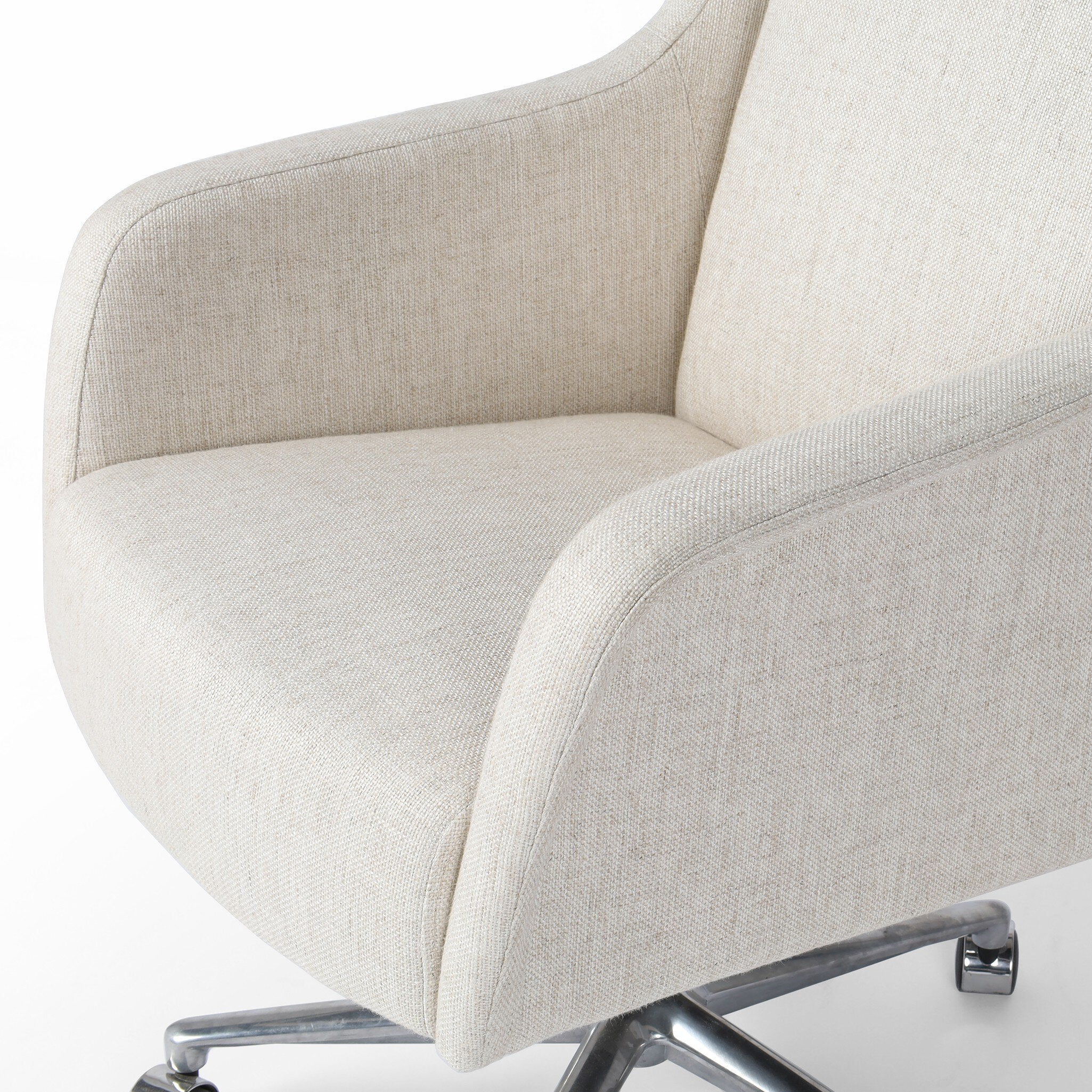 Ivory upholstered desk chair with a chrome base on a white background.